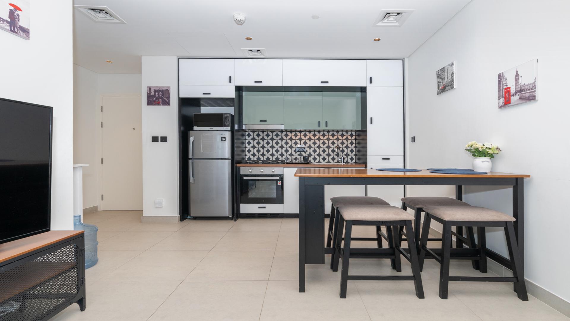 Furnished kitchen and living area in Dubai Hills Estate apartment for rent, Collective 2.0