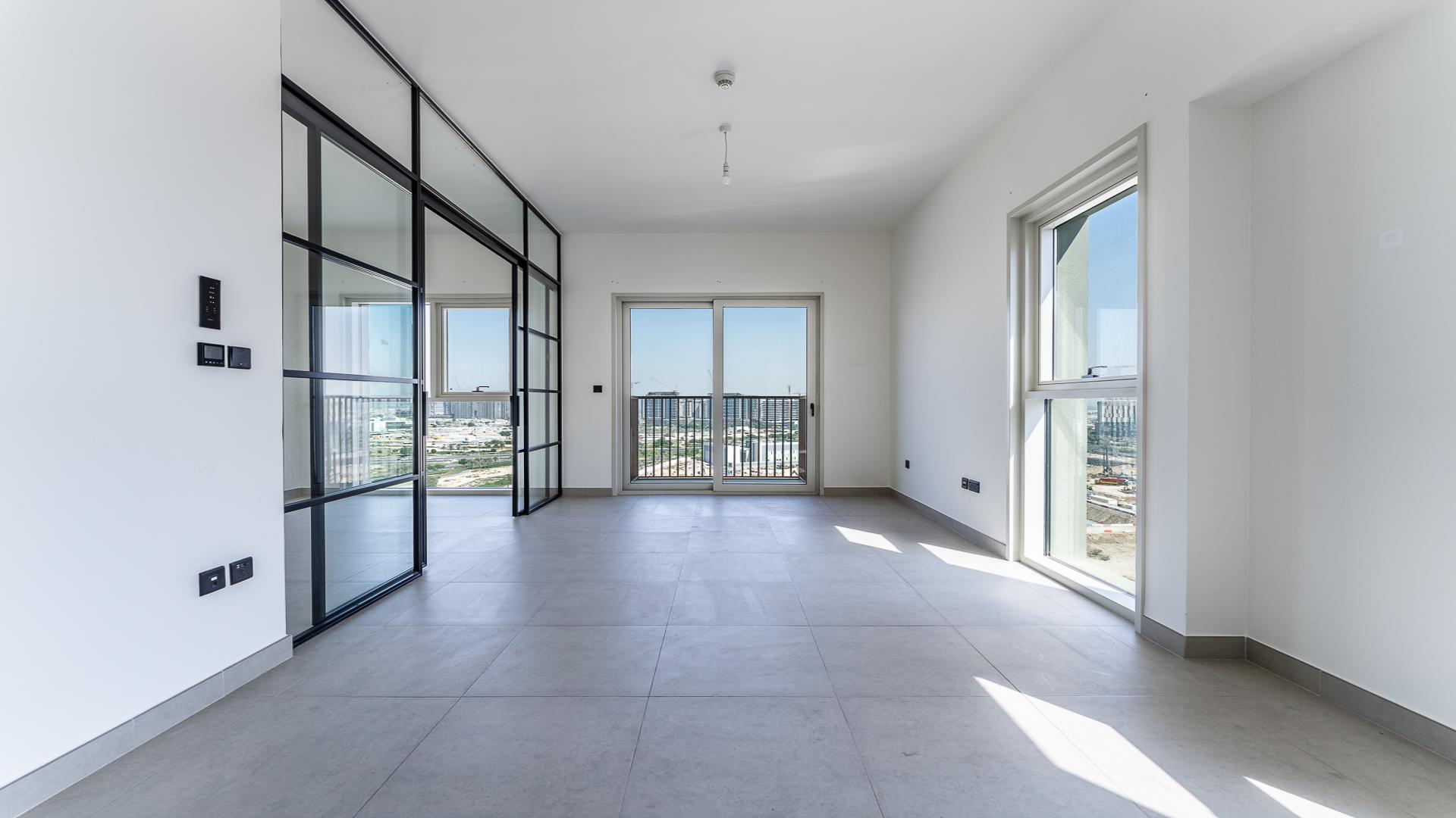 Modern living room with large windows, Dubai Hills Estate apartment for rent