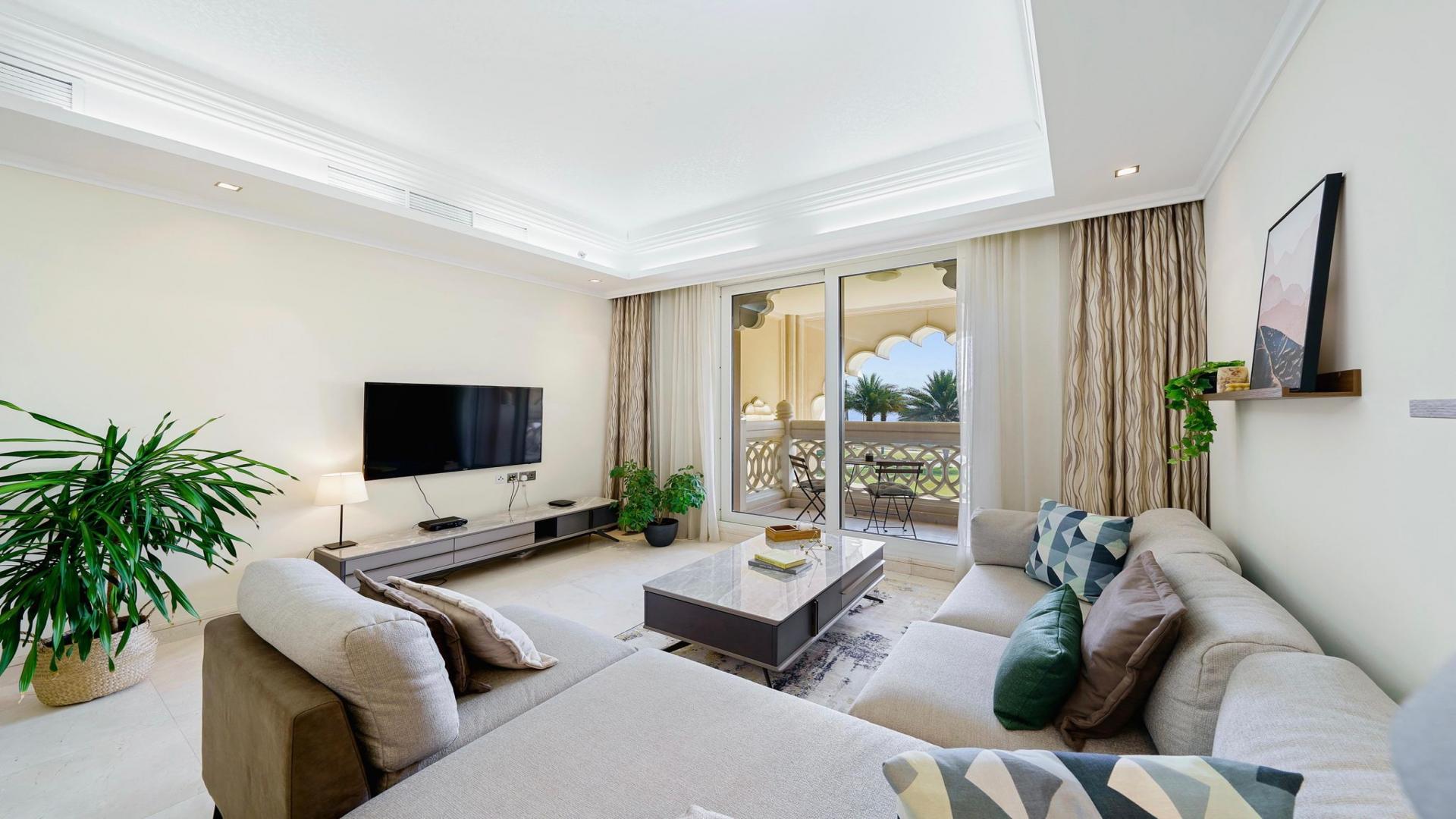 Luxurious living and dining area in 2-bedroom Palm Jumeirah apartment with sea views