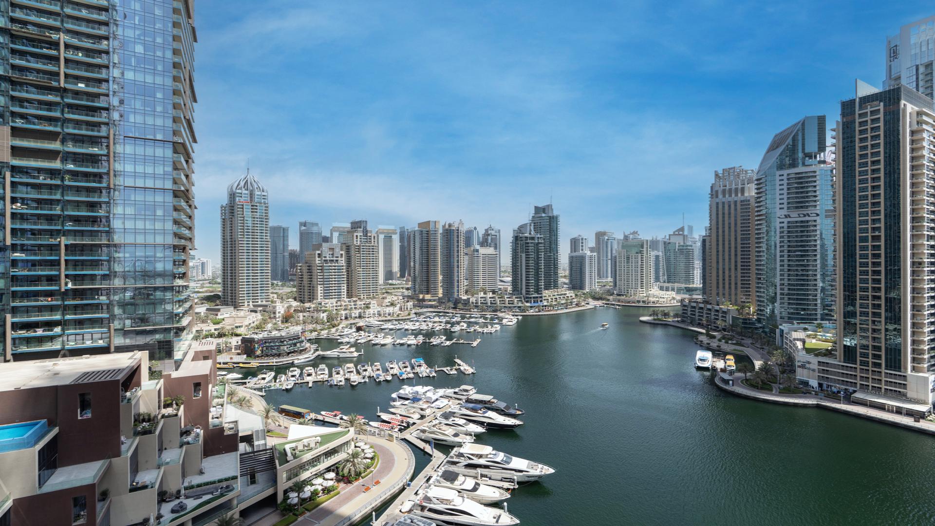 Luxury living room in Damac Heights apartment, Dubai Marina, with modern decor and city view