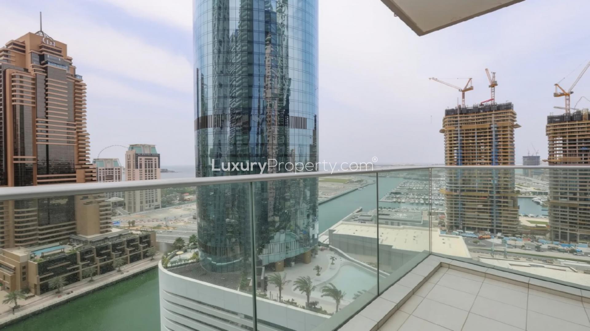 Spacious unfurnished living area in Damac Heights apartment, Dubai Marina, with modern chandelier