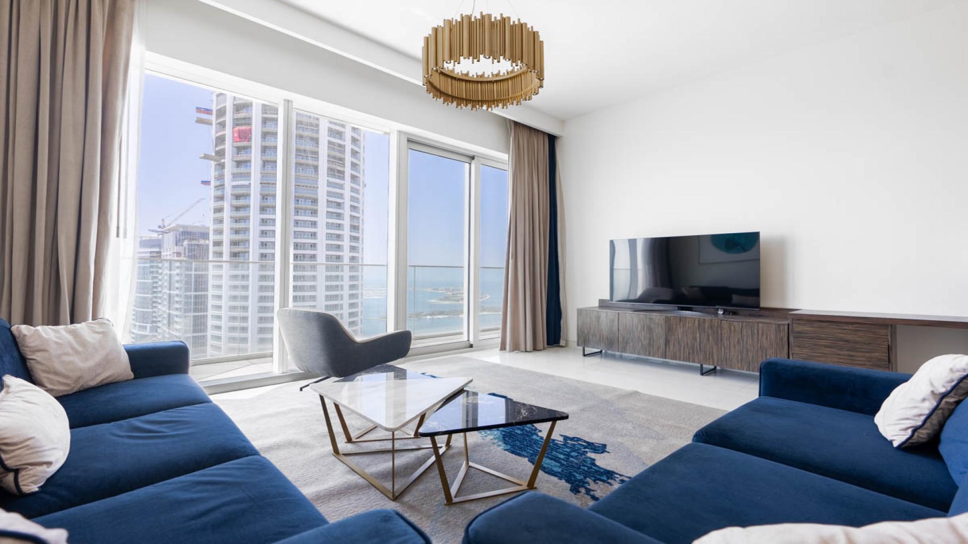 High-floor apartment balcony view of Dubai Marina skyline and Palm Jumeirah, Avani Palm View