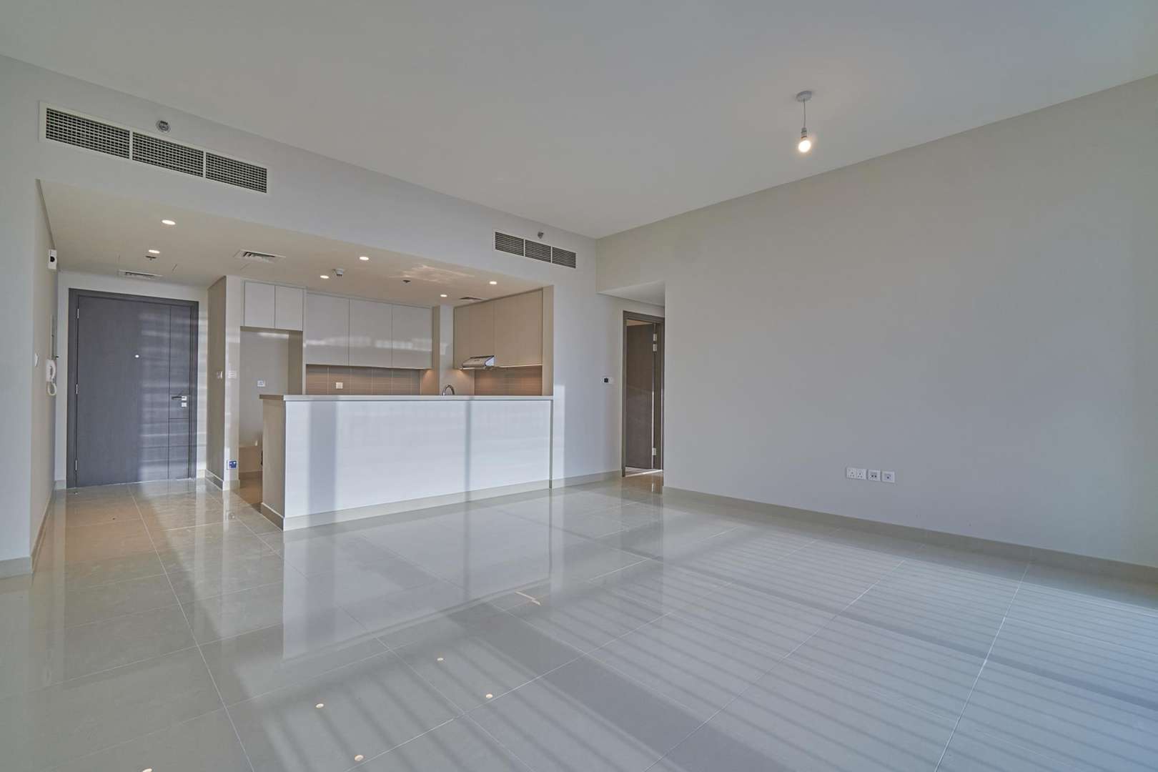 Bright living room with large windows in Dubai Creek Harbour apartment for rent