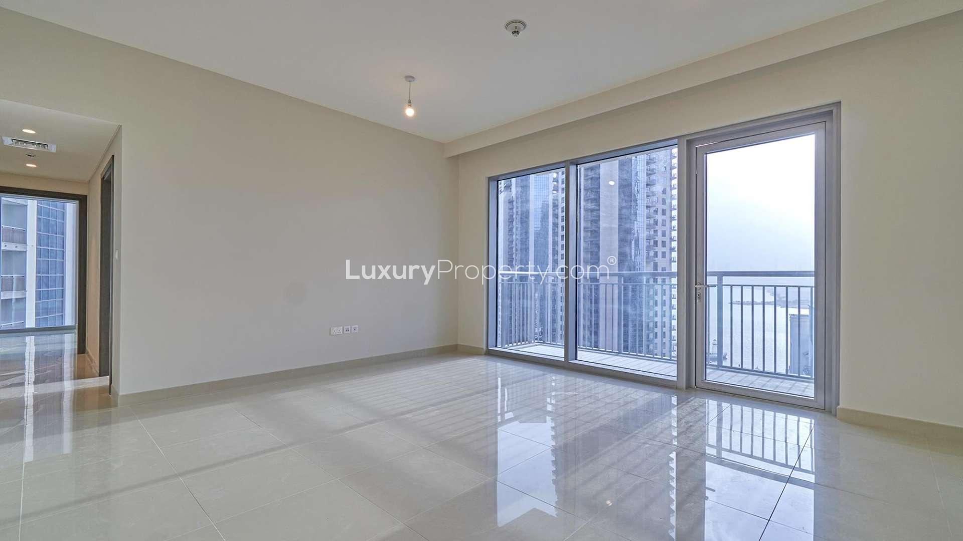 Modern open-plan kitchen and living area in Dubai Creek Harbour apartment for rent