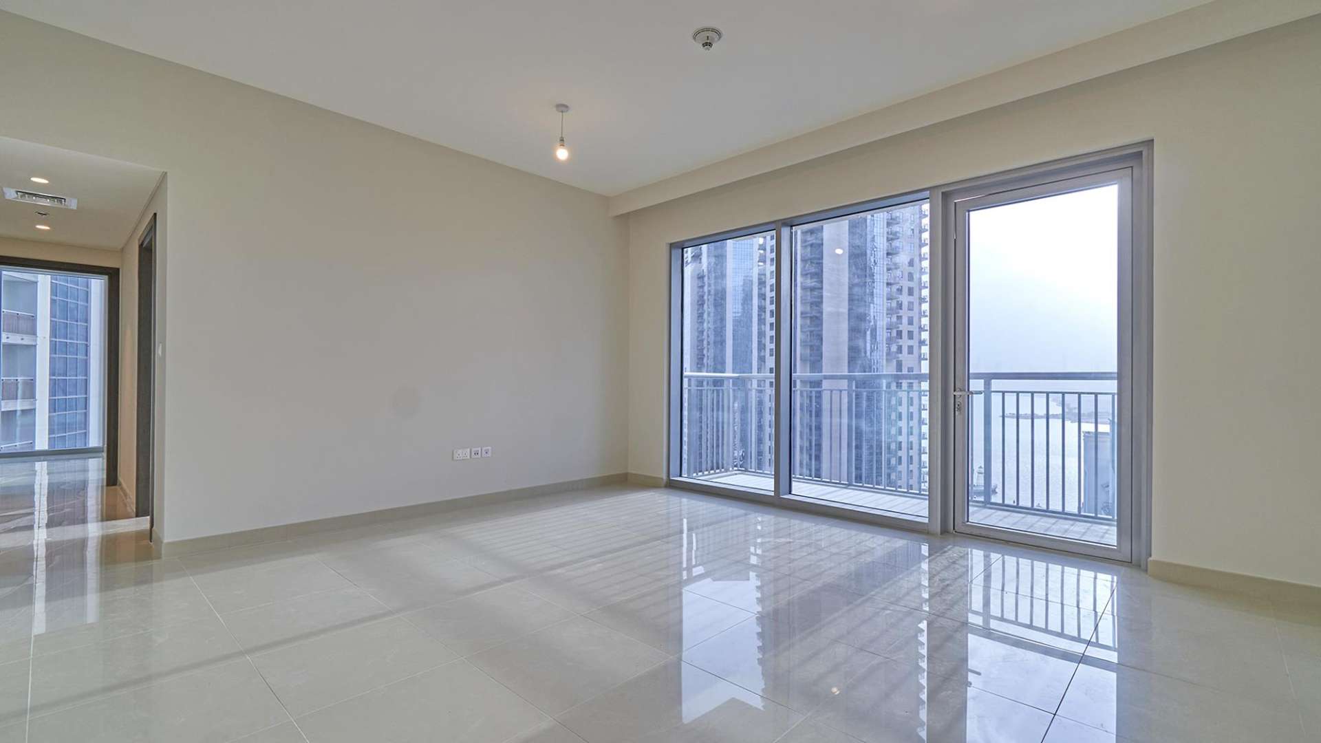 Modern open-plan kitchen and living area in Dubai Creek Harbour apartment for rent