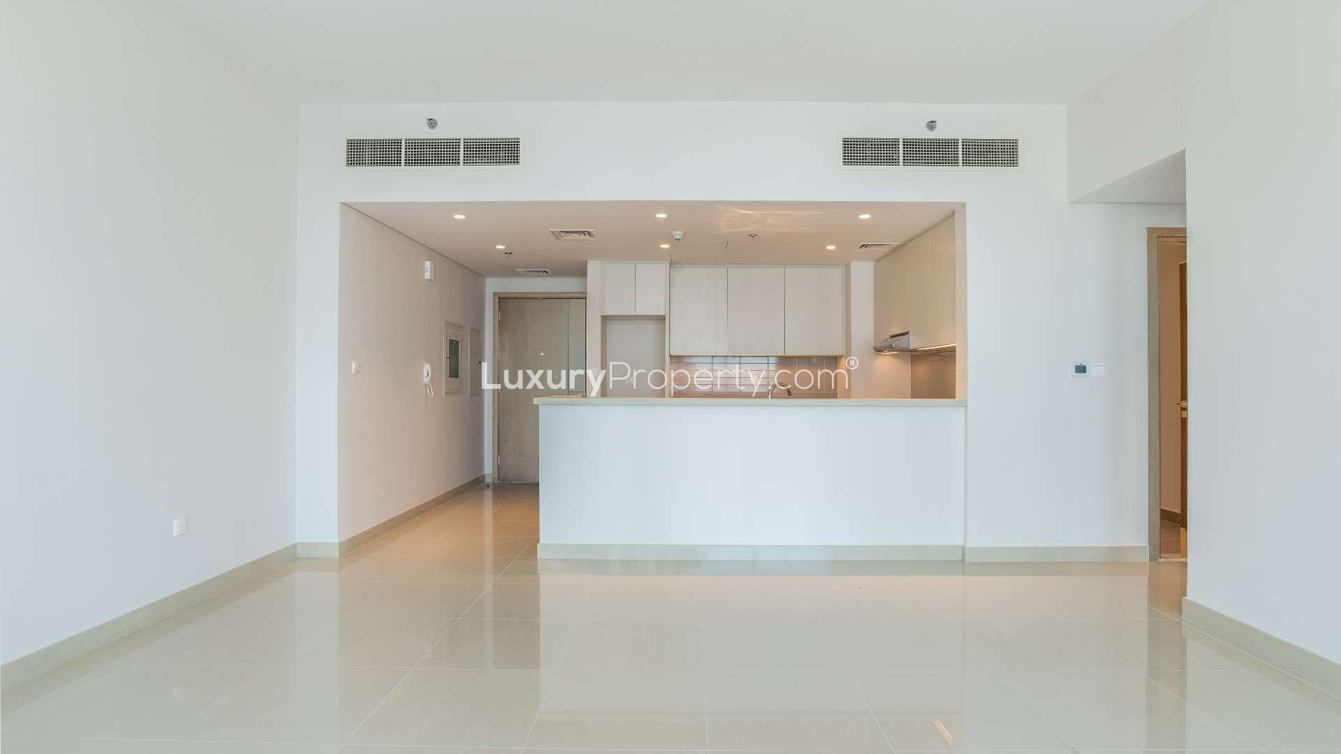 Modern kitchen and living area in Dubai Creek Harbour apartment for rent