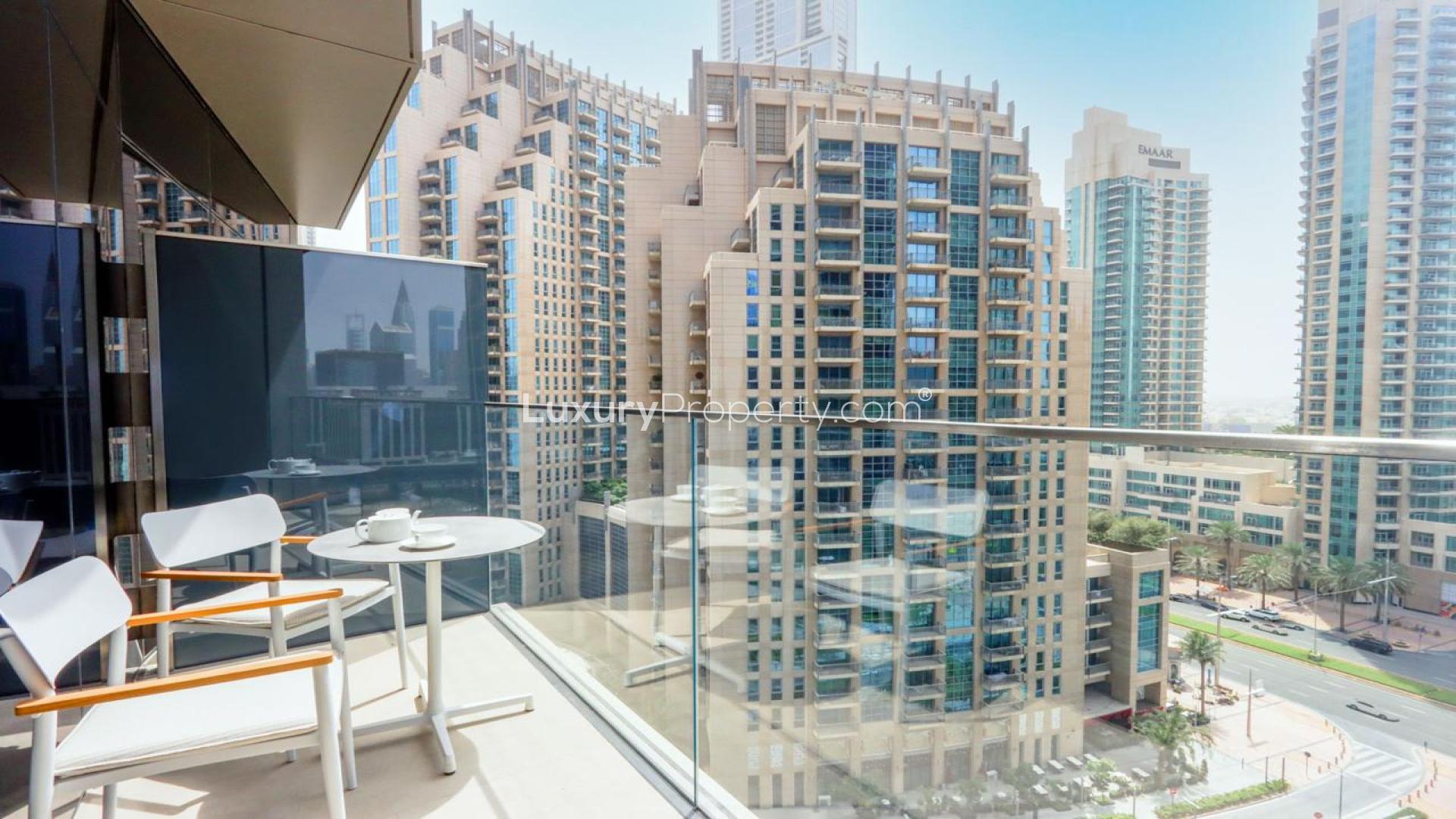 Fully furnished kitchen and living area in Downtown Dubai 2-bedroom apartment for rent