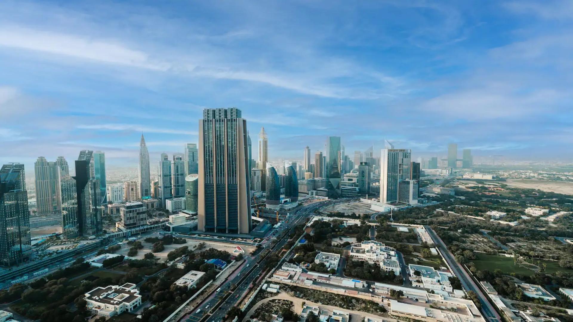 Stylish living room in Downtown Views II apartment, Dubai with modern decor and balcony view
