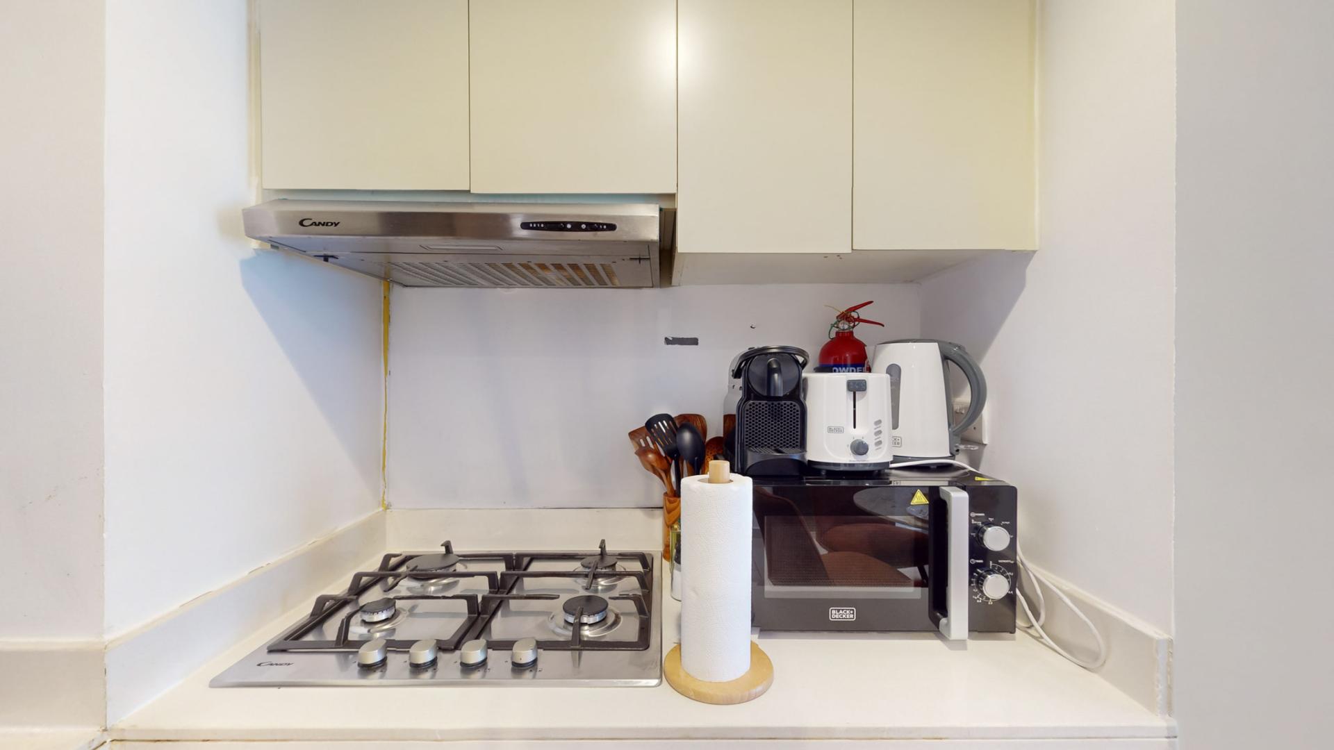 Modern kitchen with appliances in 2-bedroom apartment, Reva Residences, Business Bay