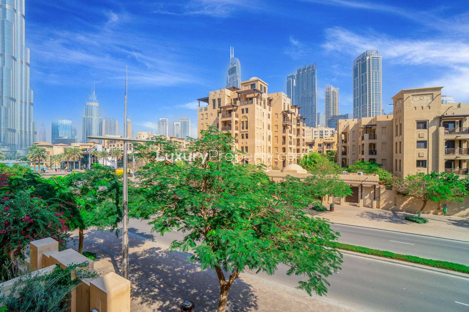 Bright, spacious living area in Kamoon apartment, Old Town, with large windows and balcony view