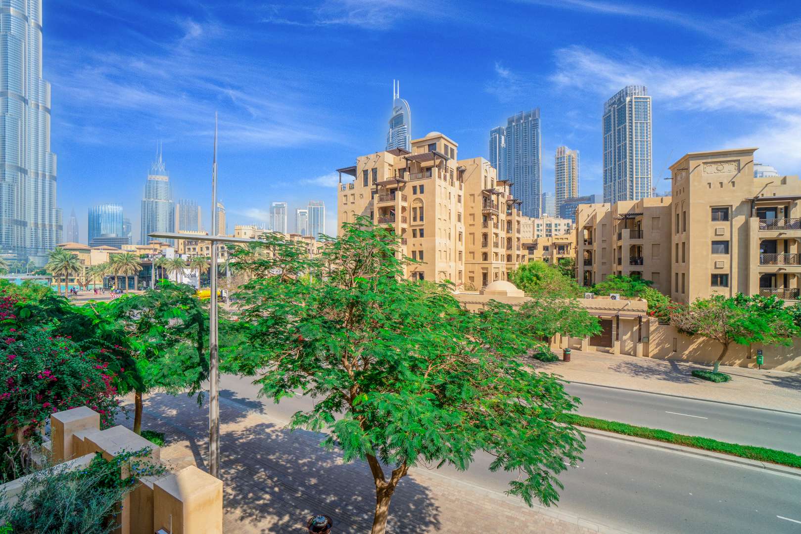 Bright, spacious living area in Kamoon apartment, Old Town, with large windows and balcony view