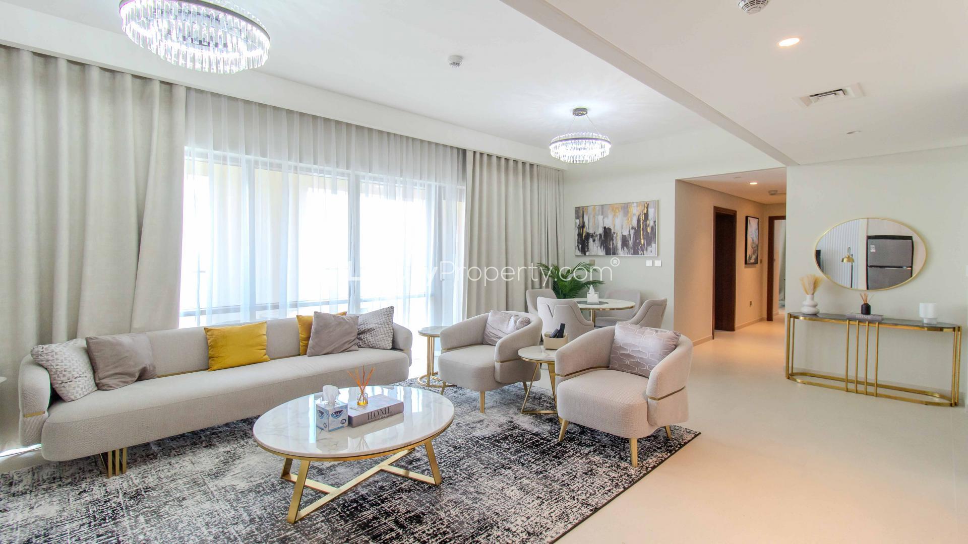 Modern living room in high-floor Dubai Creek Harbour apartment with elegant furnishings and natural light