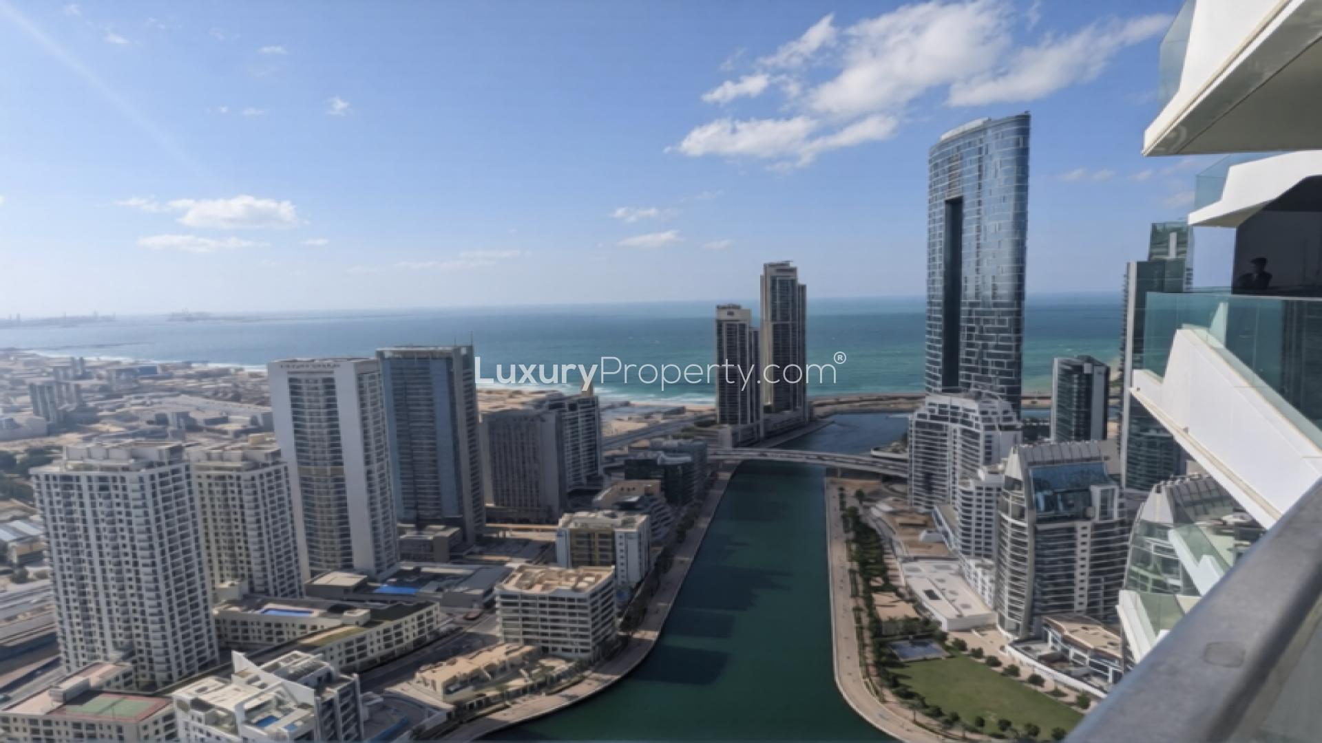 Spacious living area in Stella Maris apartment, Dubai Marina, with modern kitchen and open layout