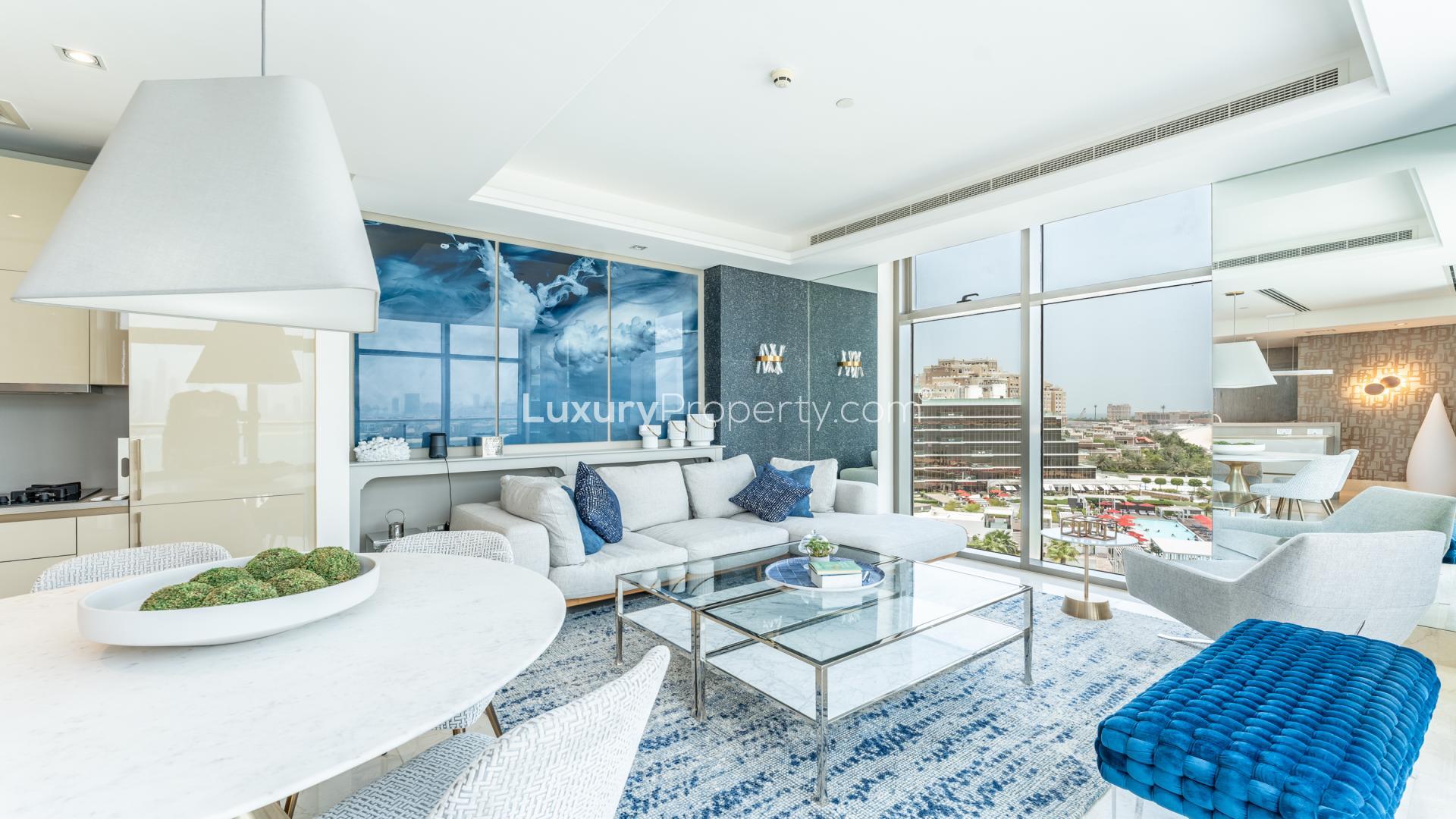 Aerial view of beachfront pool and garden at The Crescent, Palm Jumeirah apartment