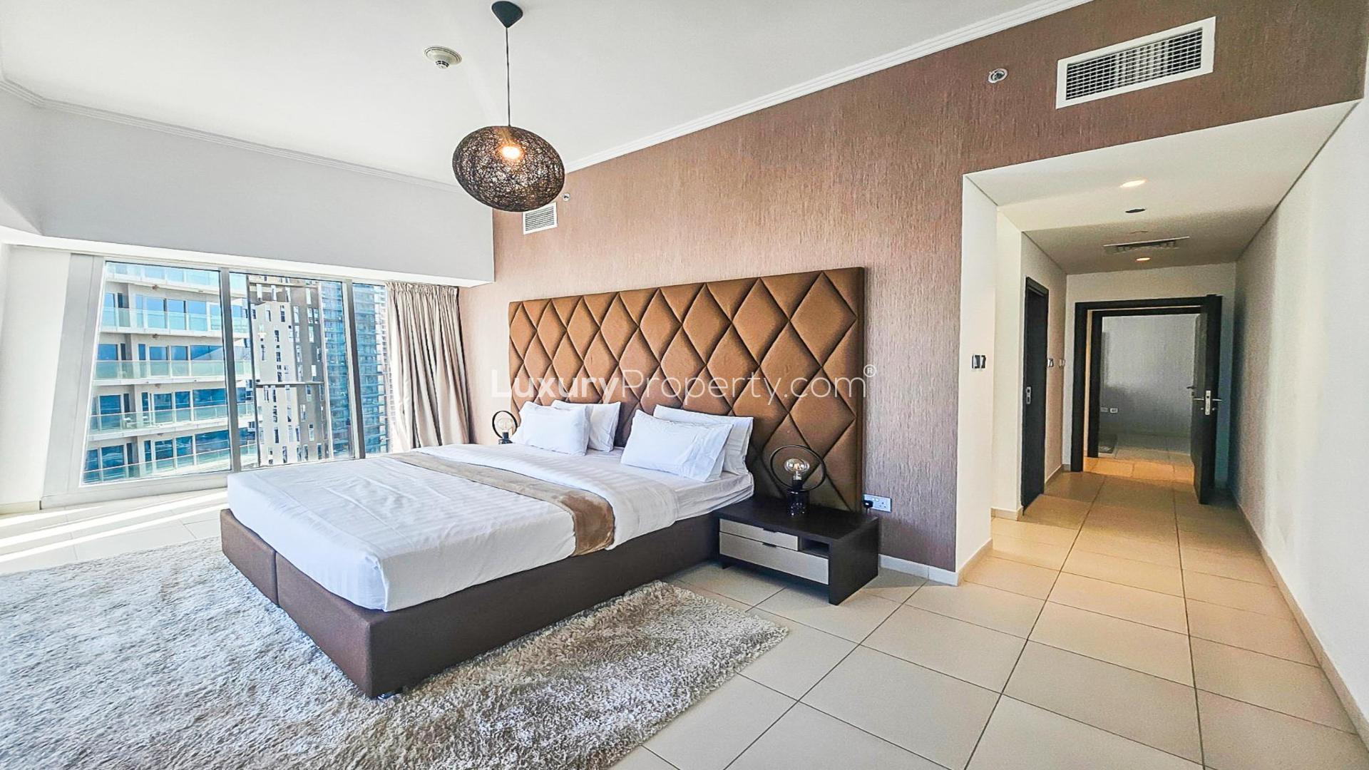 Modern living room in Cayan Tower apartment, Dubai Marina, featuring sleek furniture and decor