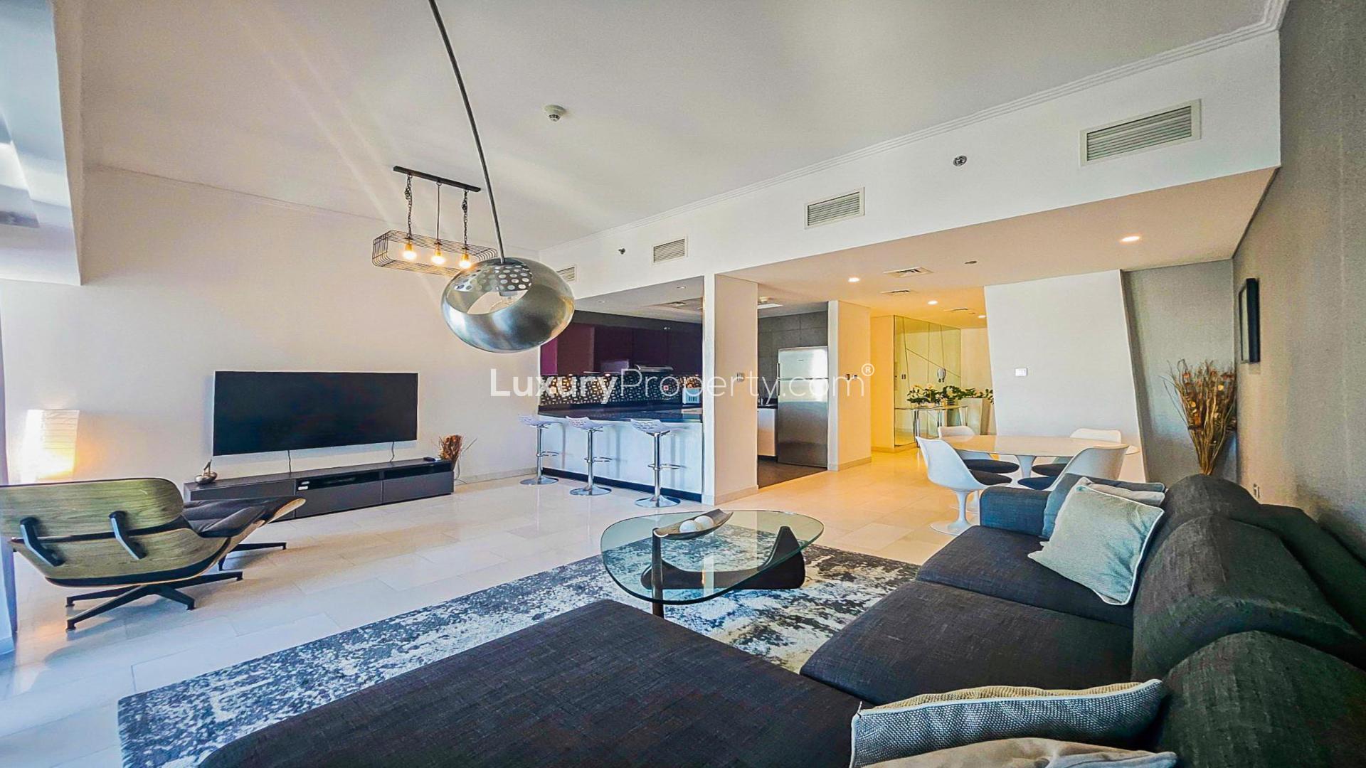 Luxurious bedroom in Cayan Tower apartment, Dubai Marina, with modern decor and city views