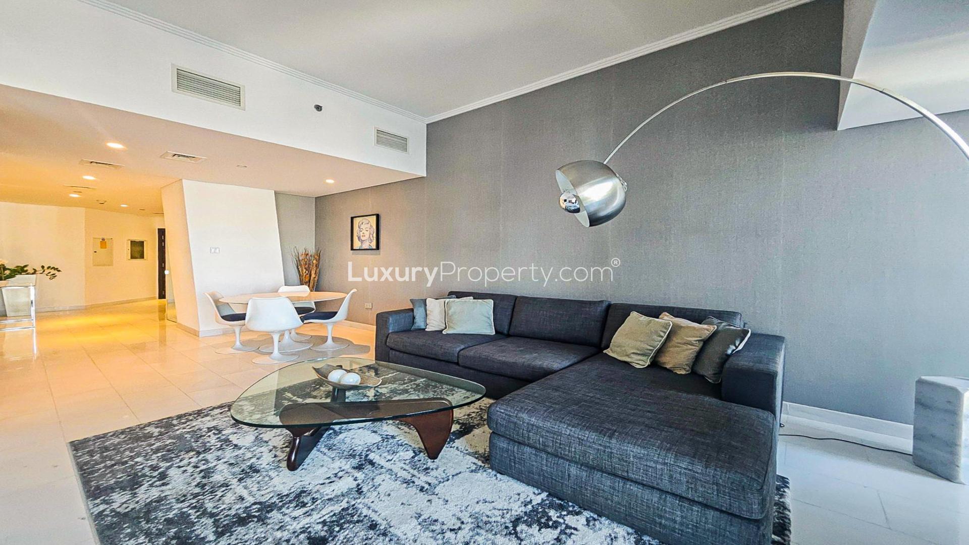 Luxurious bedroom in Cayan Tower apartment, Dubai Marina, with modern decor and city views