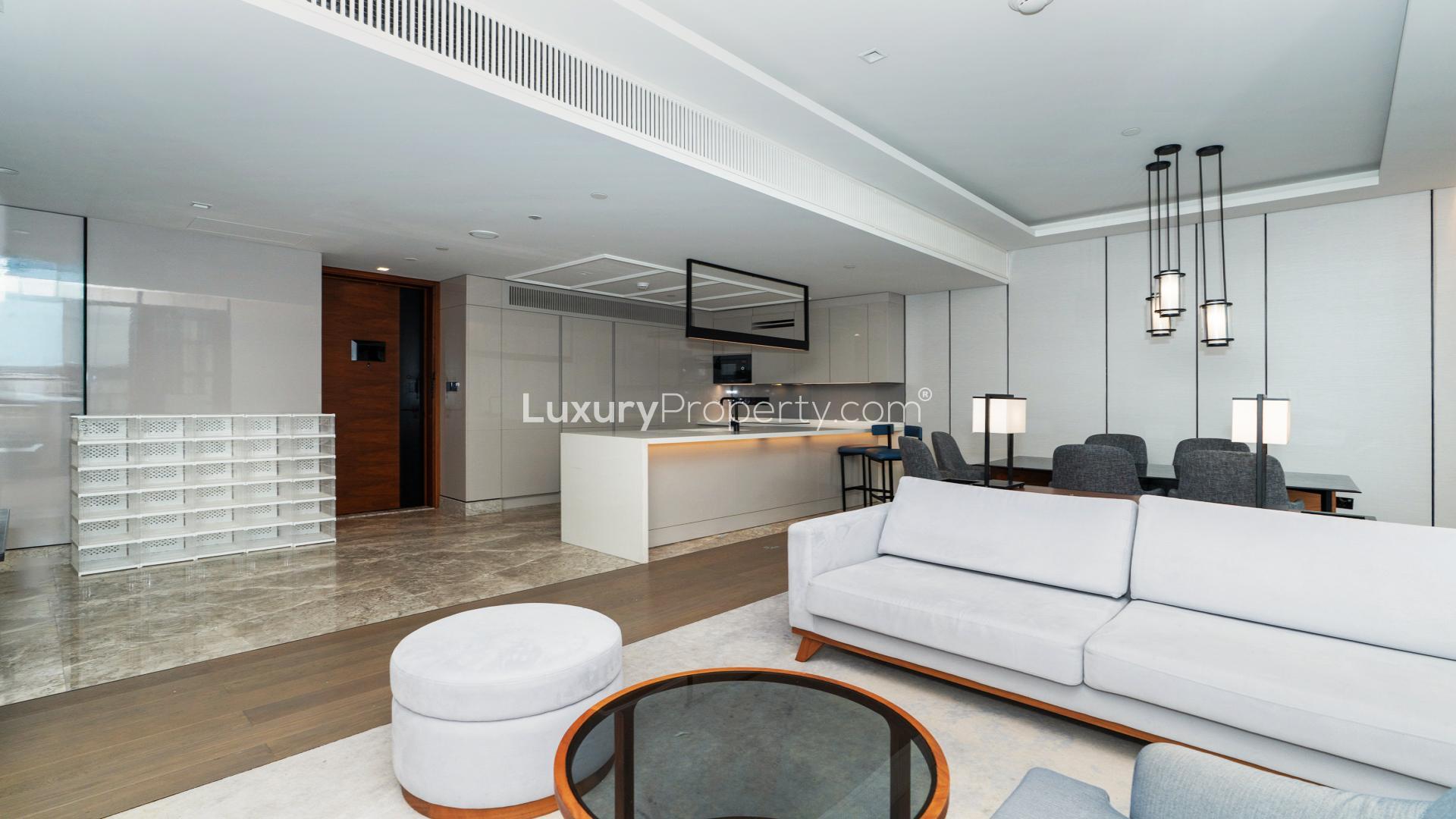 Modern kitchen and living area in Bluewaters Island apartment for rent