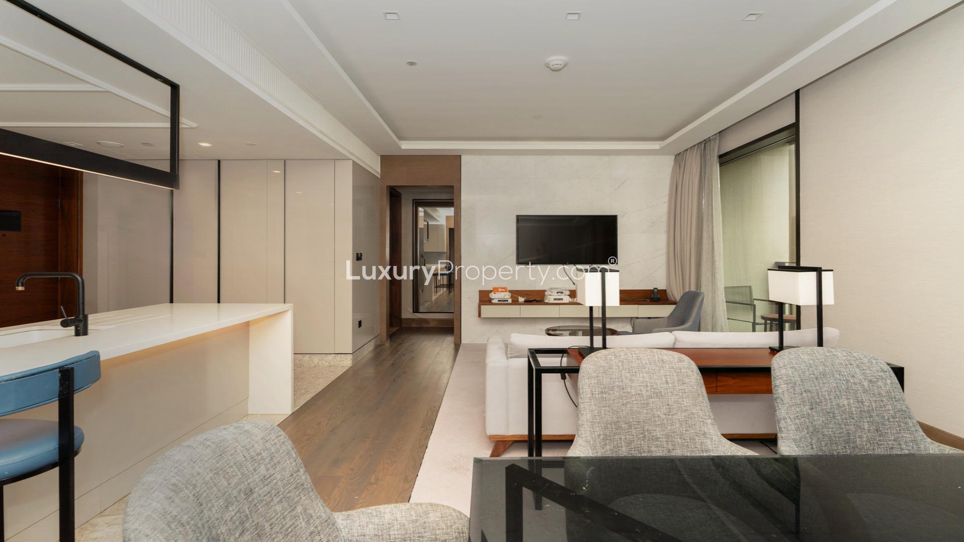 Modern living room in Bluewaters Residences apartment for rent, featuring stylish decor and balcony