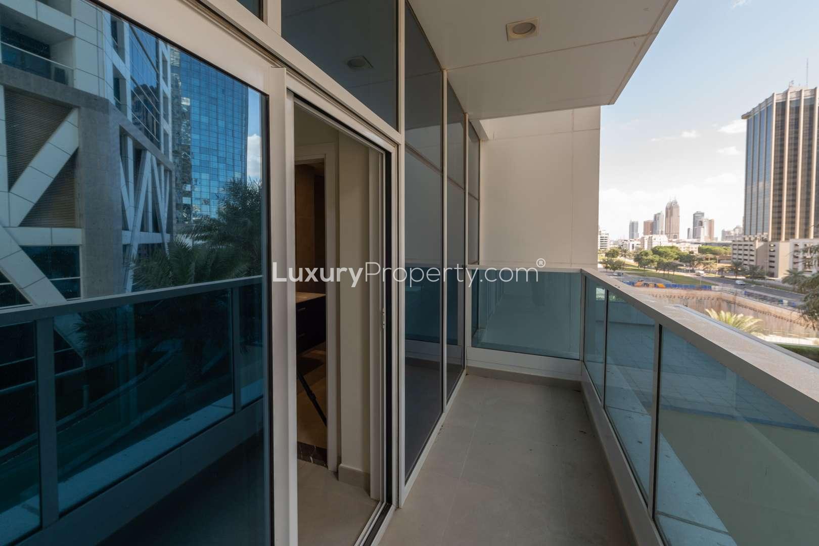 "Spacious balcony with city view in 2-bedroom apartment, Marina Arcade, Dubai Marina.","Spacious living room in modern 2-bedroom apartment, Marina Arcade, Dubai Marina for rent.",Modern kitchen in 2-bedroom apartment, Marina Arcade, Dubai Marina, with washer and sleek cabinets