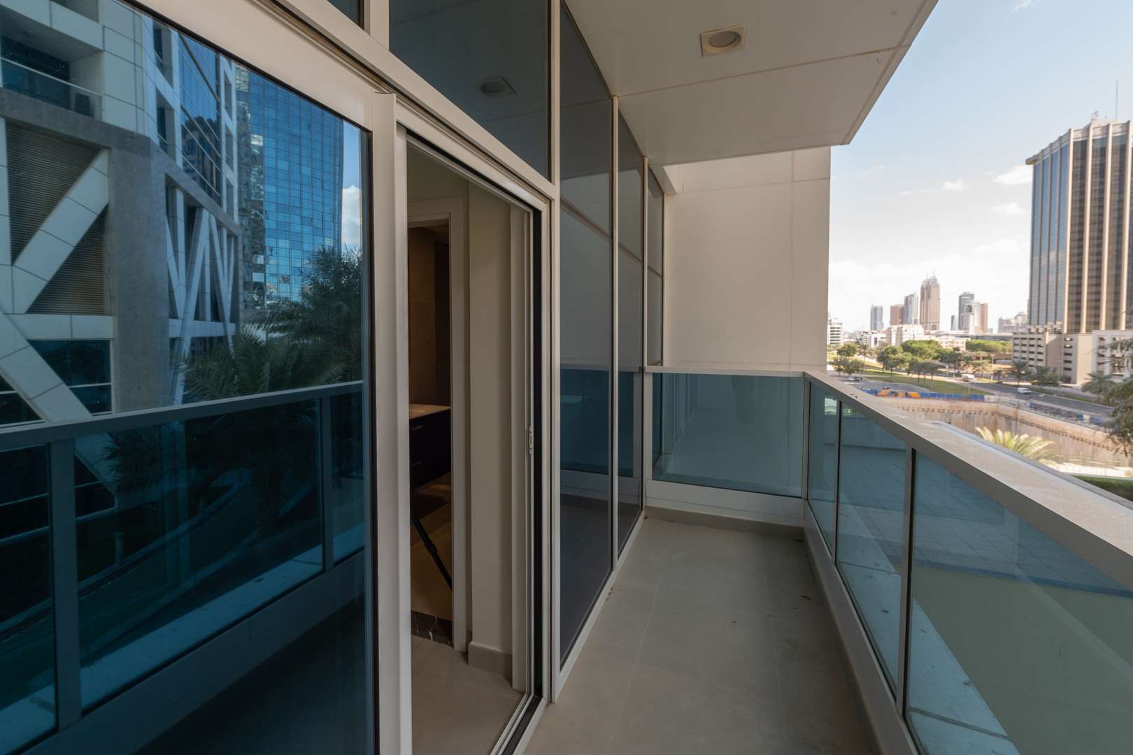 "Spacious balcony with city view in 2-bedroom apartment, Marina Arcade, Dubai Marina.","Spacious living room in modern 2-bedroom apartment, Marina Arcade, Dubai Marina for rent.",Modern kitchen in 2-bedroom apartment, Marina Arcade, Dubai Marina, with washer and sleek cabinets