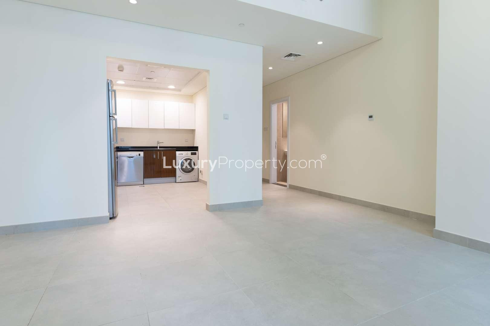 Sunlit apartment interior with integrated kitchen in Marina Arcade Tower, Dubai Marina
