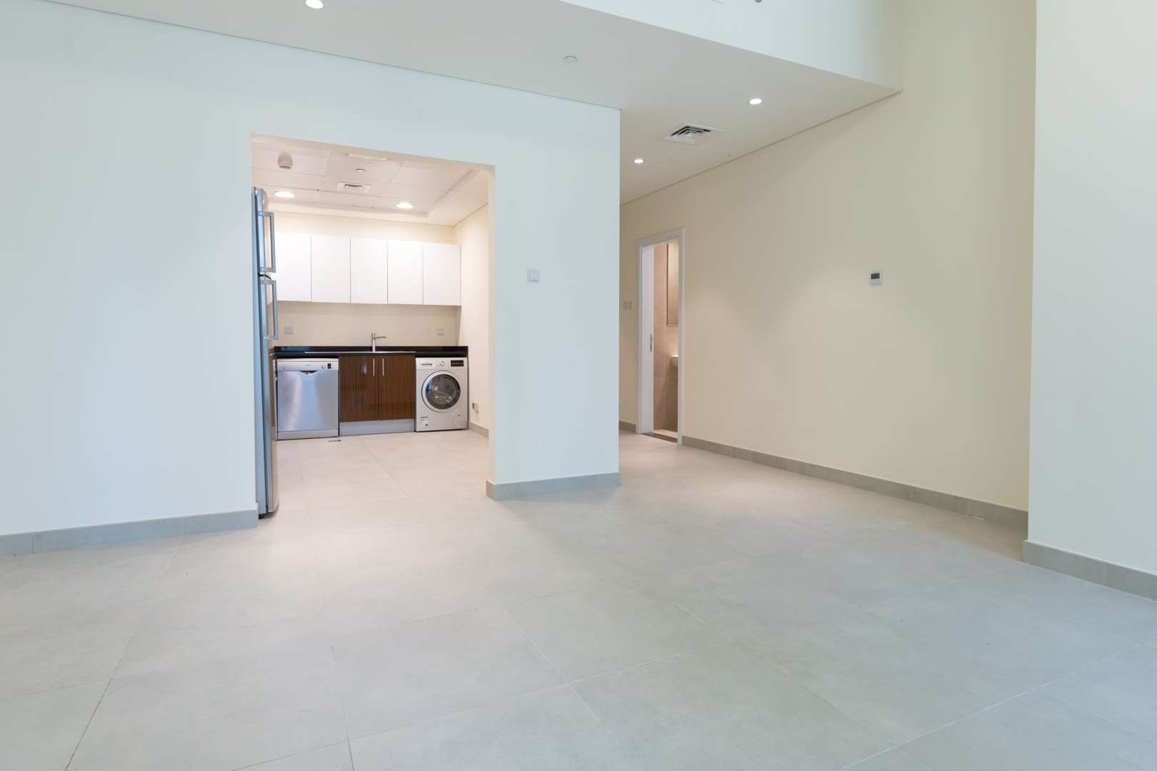 Sunlit apartment interior with integrated kitchen in Marina Arcade Tower, Dubai Marina