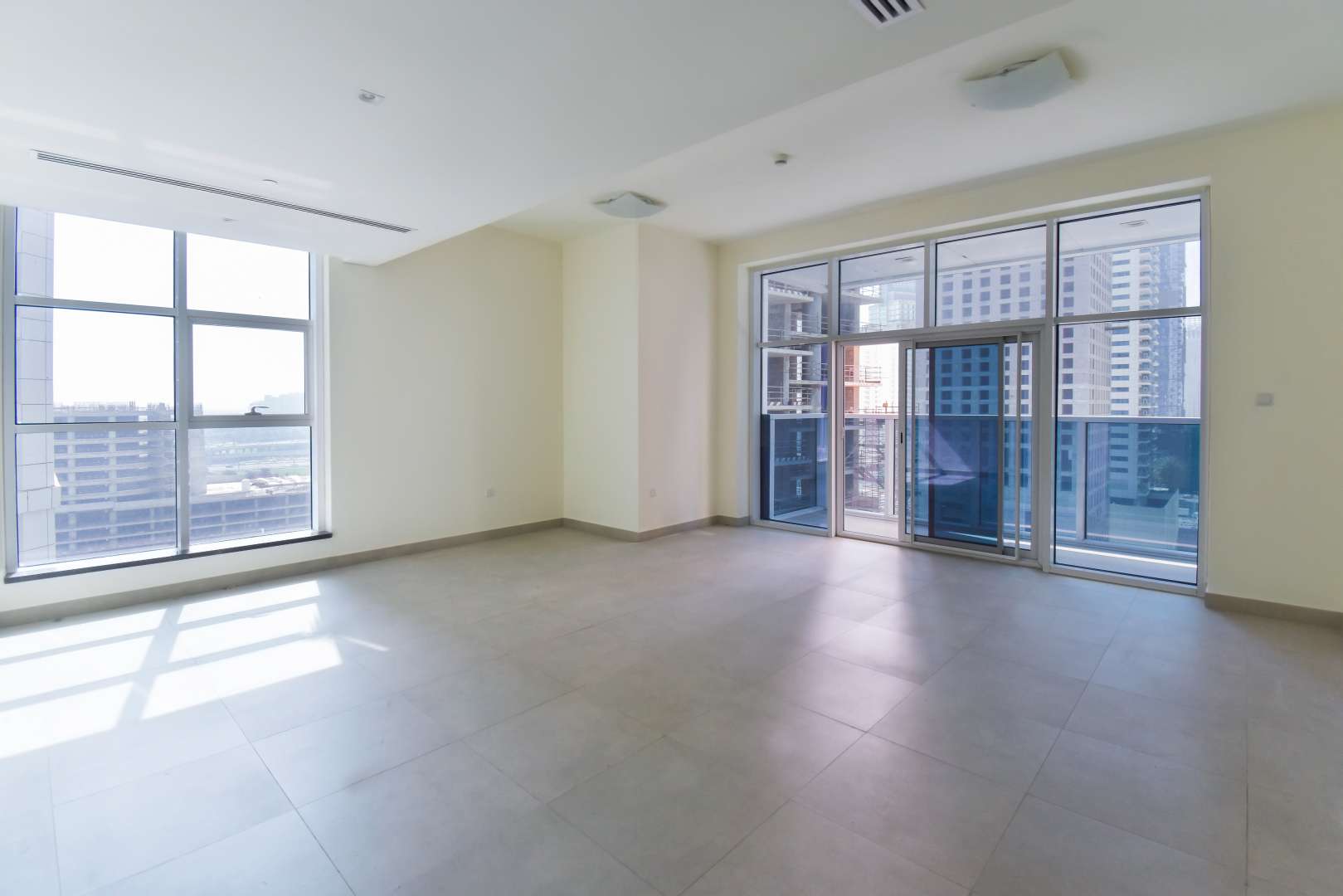 Bright room with open door to bathroom in Marina Arcade, Dubai Marina apartment