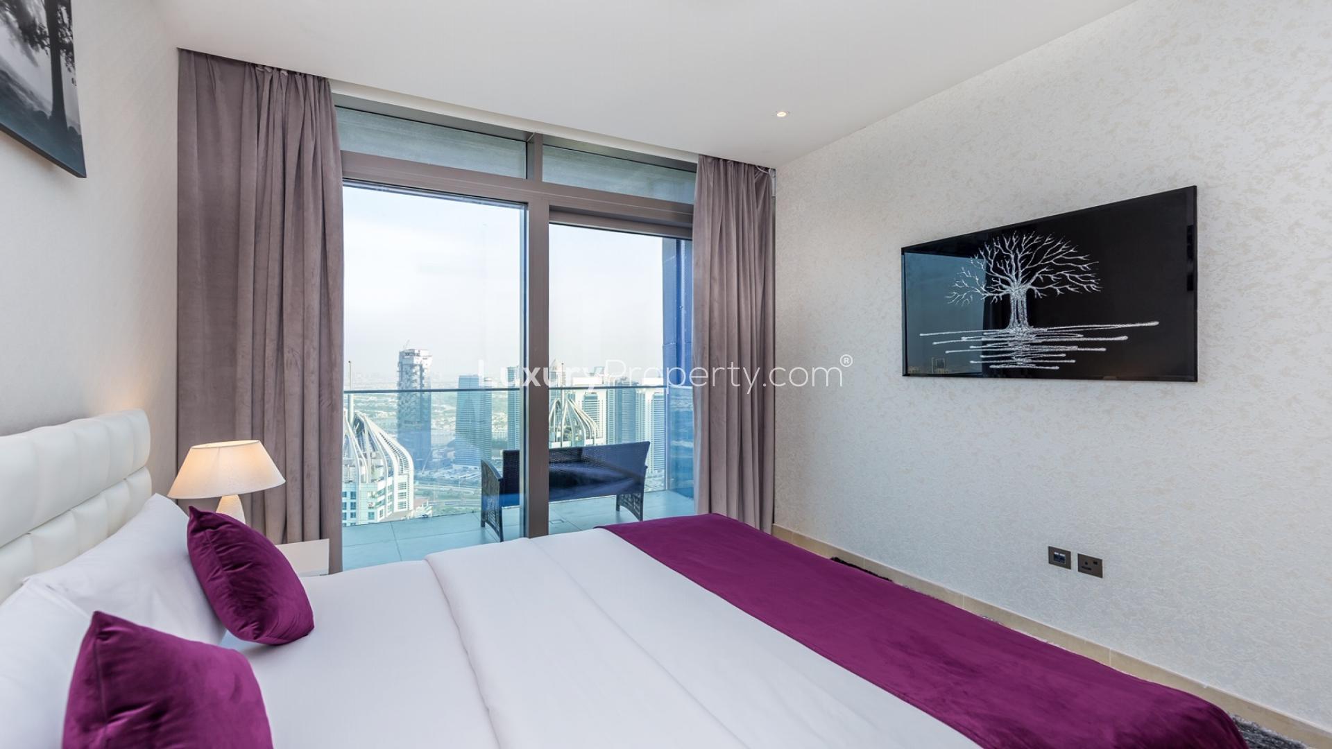 Stylish bedroom with city view in Marina Gate, Dubai two-bedroom apartment for rent