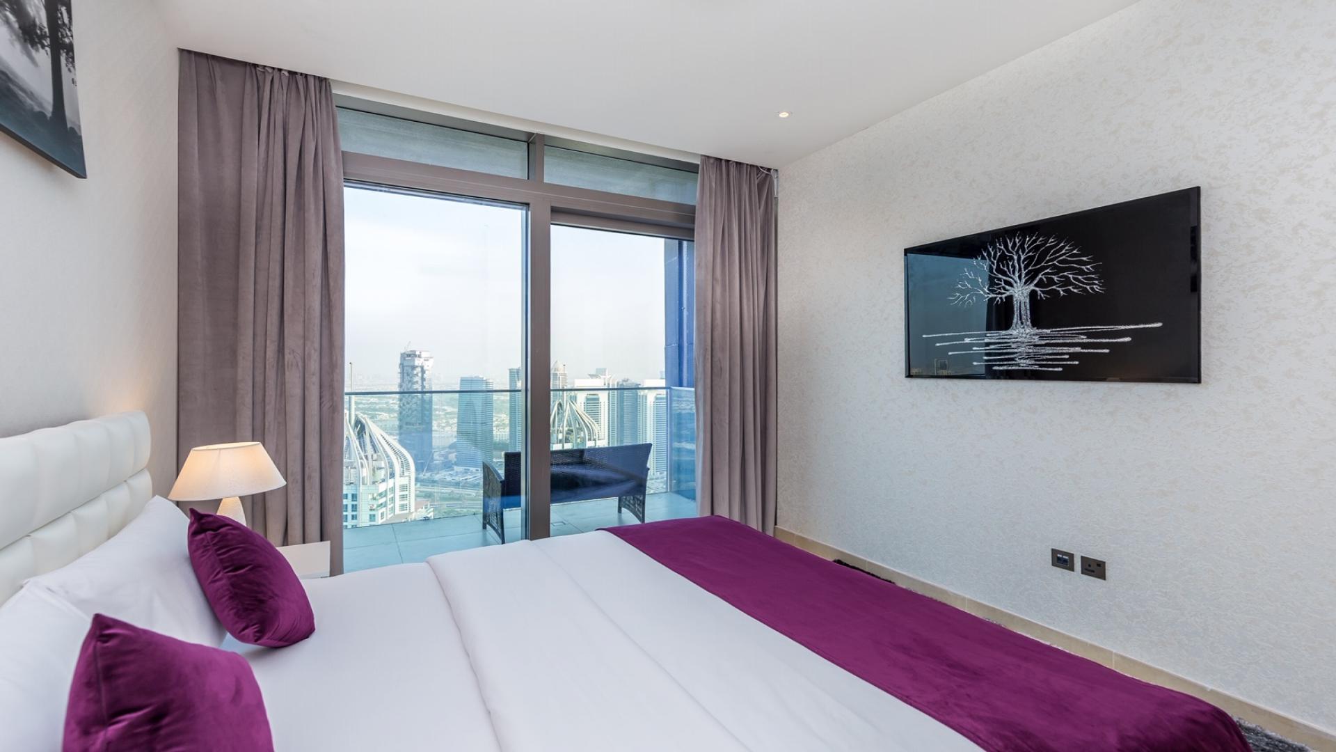 Stylish bedroom with city view in Marina Gate, Dubai two-bedroom apartment for rent