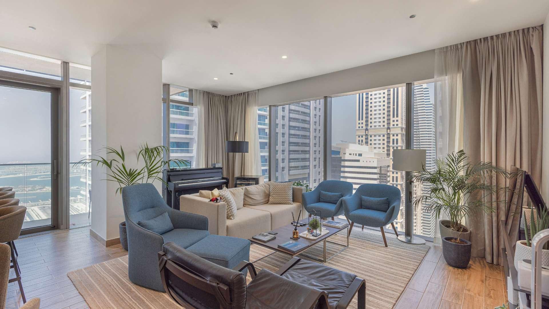 High-floor apartment balcony view overlooking Dubai Marina skyscrapers in Marina Gate community