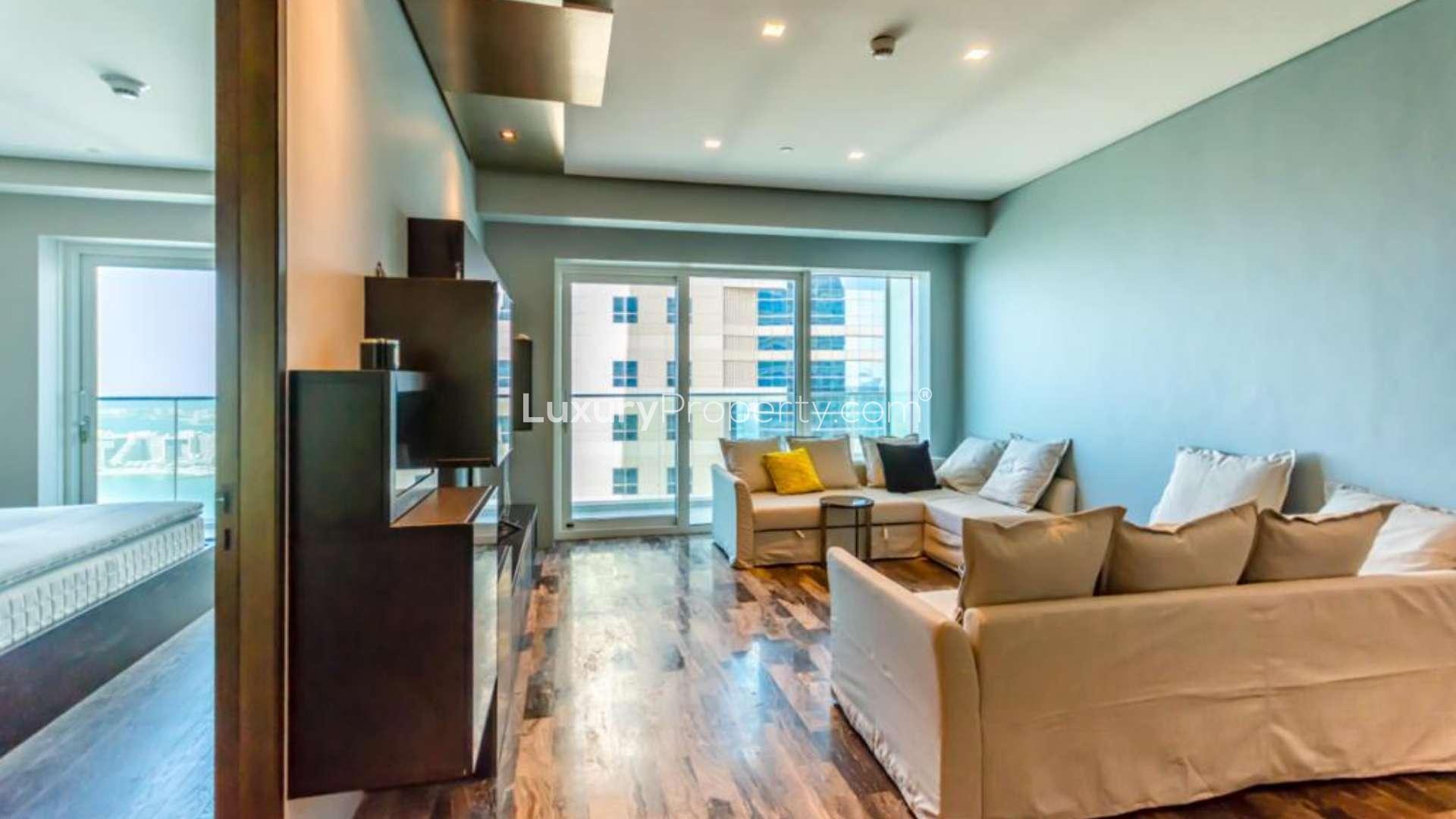 "Stunning marina view from luxury 2-bedroom apartment in Marina Heights, Dubai Marina.",Luxury Marina Heights apartment living room with modern decor, large windows, and marina view
