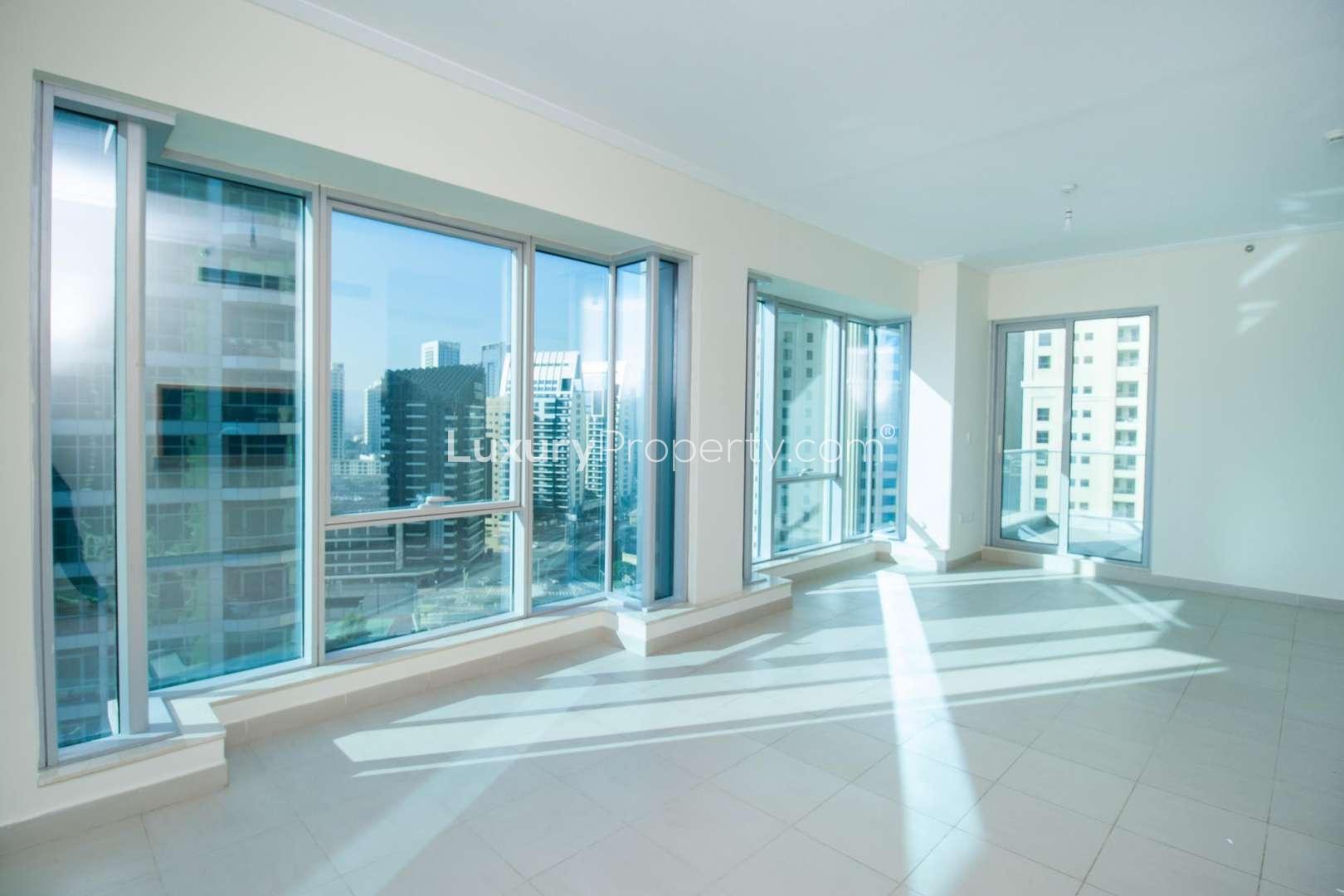 Balcony view of Marina Canal and skyscrapers in Marina Promenade, Dubai Marina apartment
