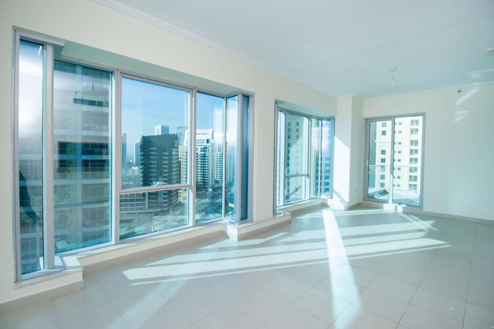 Balcony view of Marina Canal and skyscrapers in Marina Promenade, Dubai Marina apartment