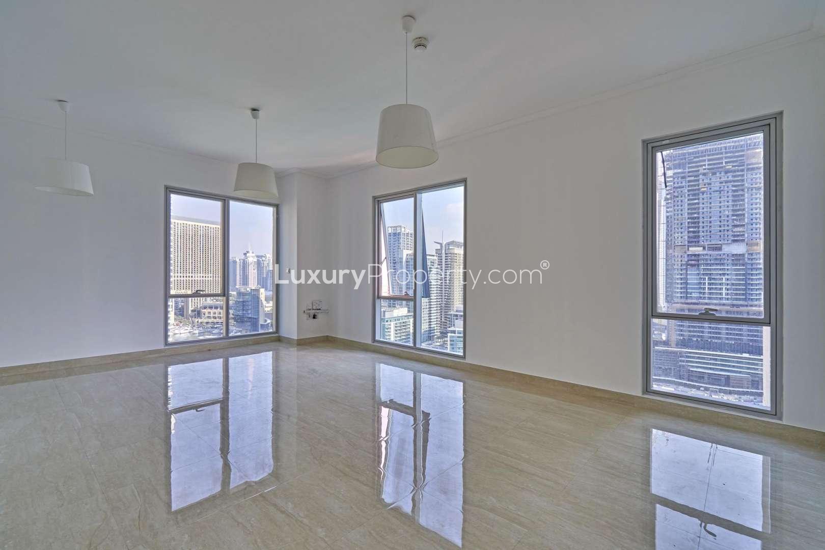 Spacious living area with large windows in Beauport Tower, Dubai Marina apartment