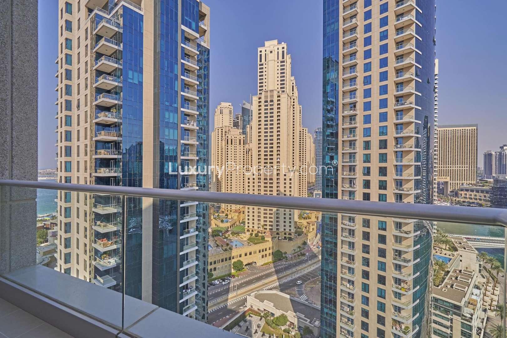 Balcony view from Beauport Tower apartment overlooking Dubai Marina waterfront and skyline