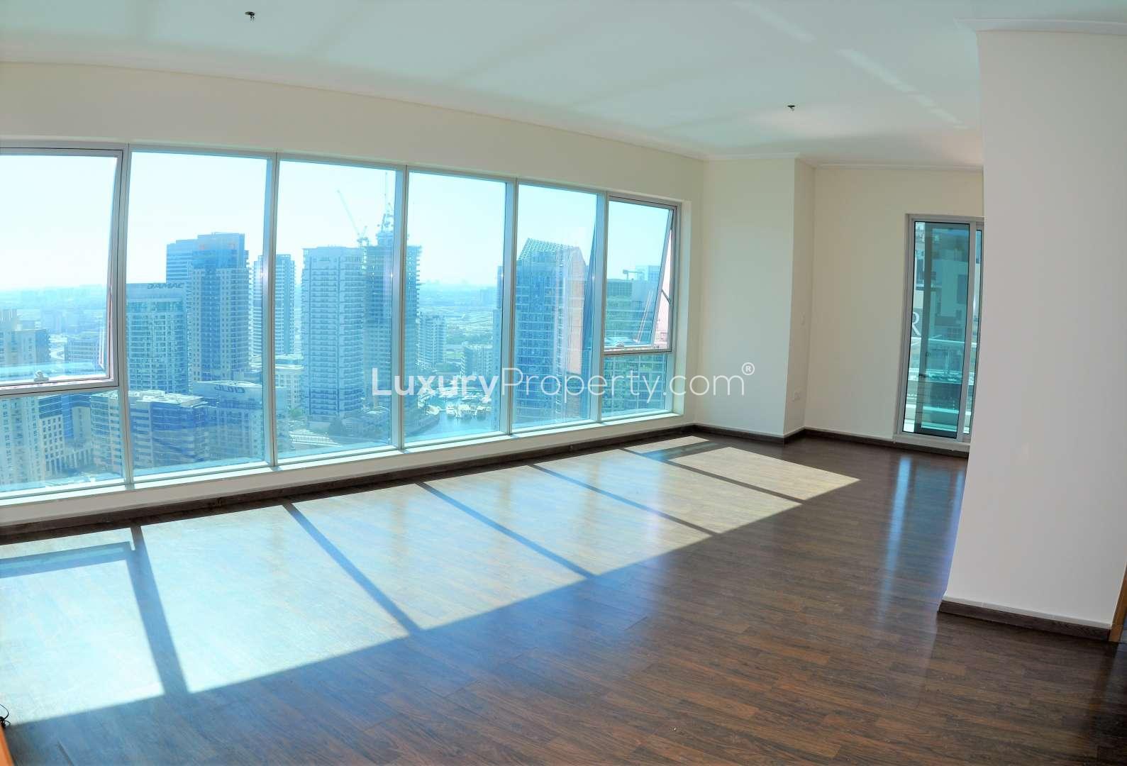 High-floor two-bedroom apartment with panoramic marina views, wooden flooring, and modern kitchen in Dubai