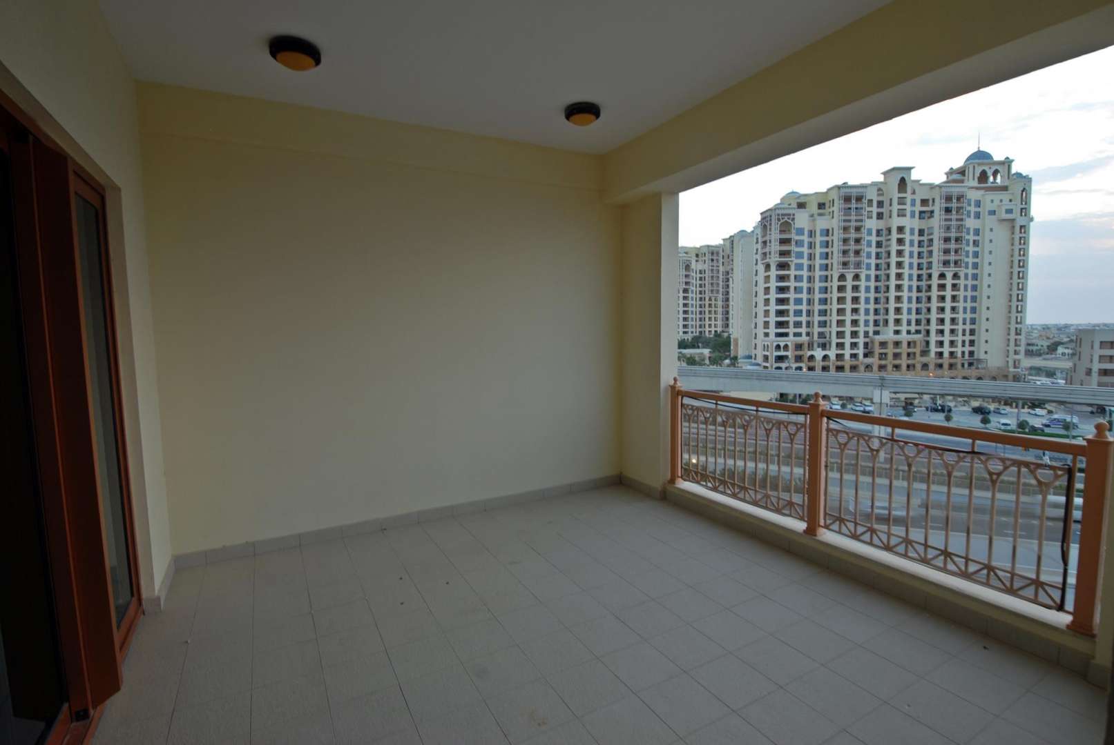 Modern kitchen in 2-bedroom apartment, Marina Residences, Palm Jumeirah, with wood cabinets and appliances