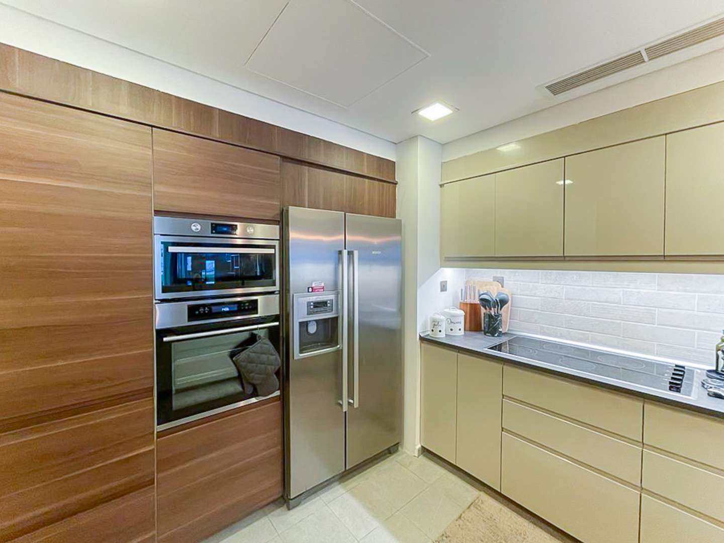 Modern kitchen in upgraded Palm Jumeirah apartment, featuring sleek cabinetry and contemporary design
