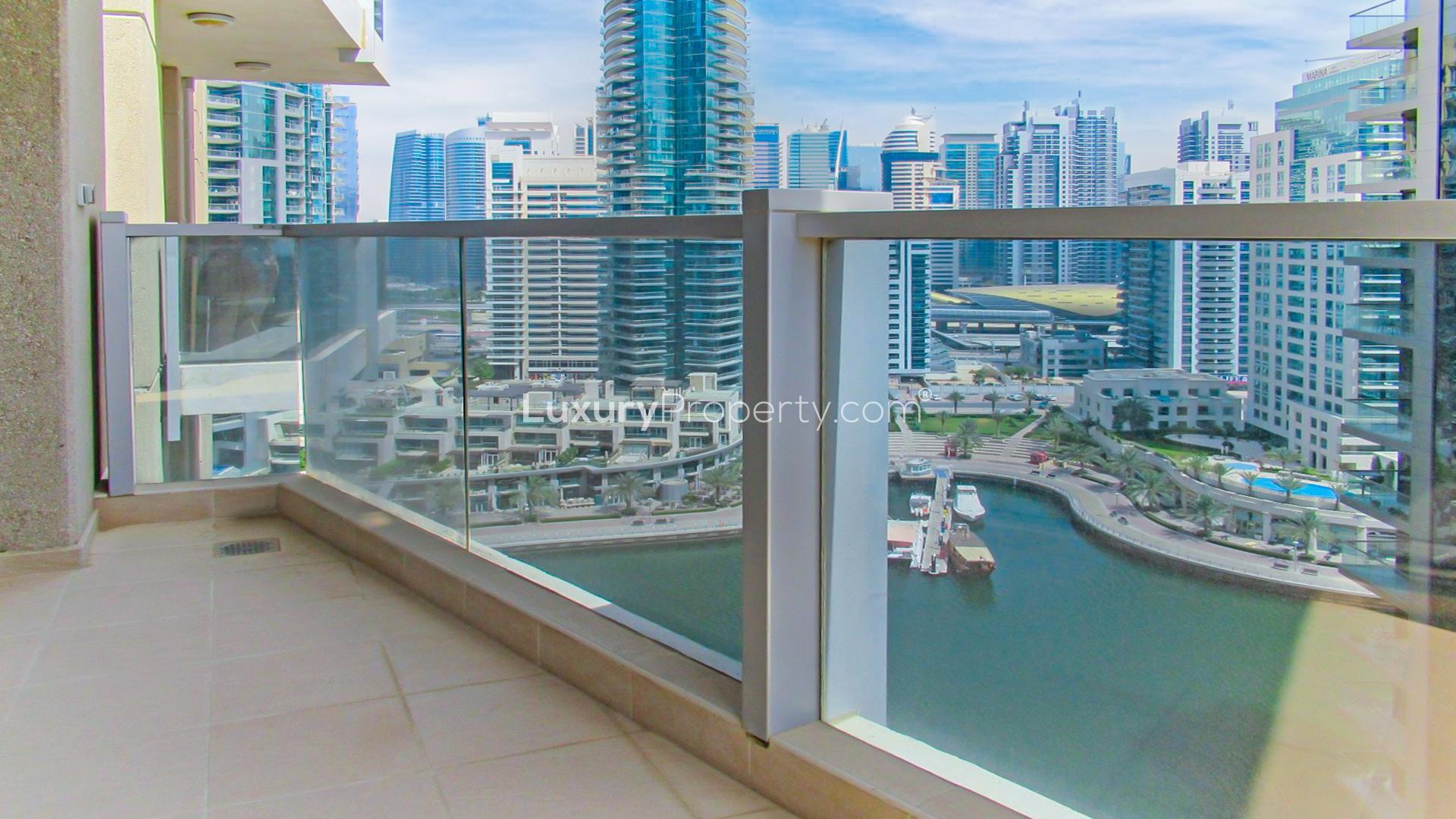 "Spacious living area with marina view, two-bedroom apartment in Marina Tower, Dubai Marina.",Balcony view of Dubai Marina from two-bedroom apartment in Marina Tower for rent