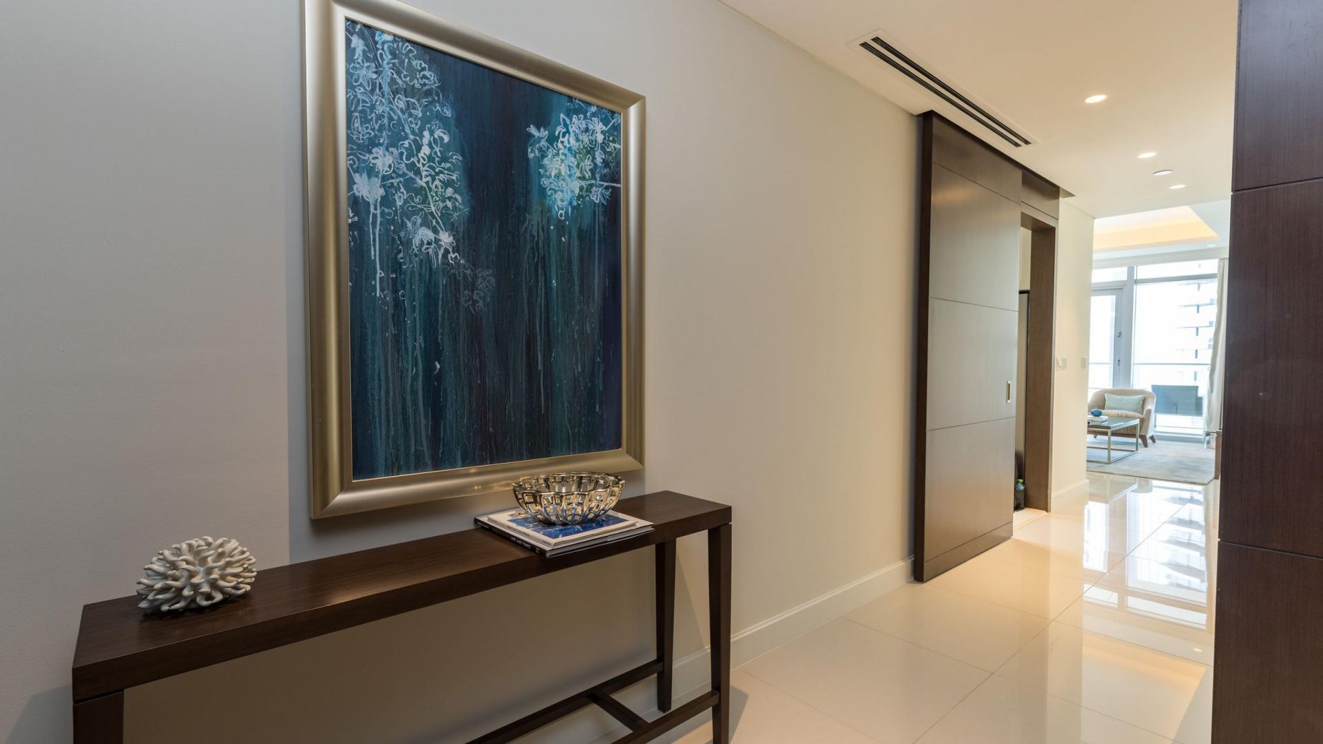 Modern living room in Downtown Dubai apartment with Burj Khalifa view, elegant decor