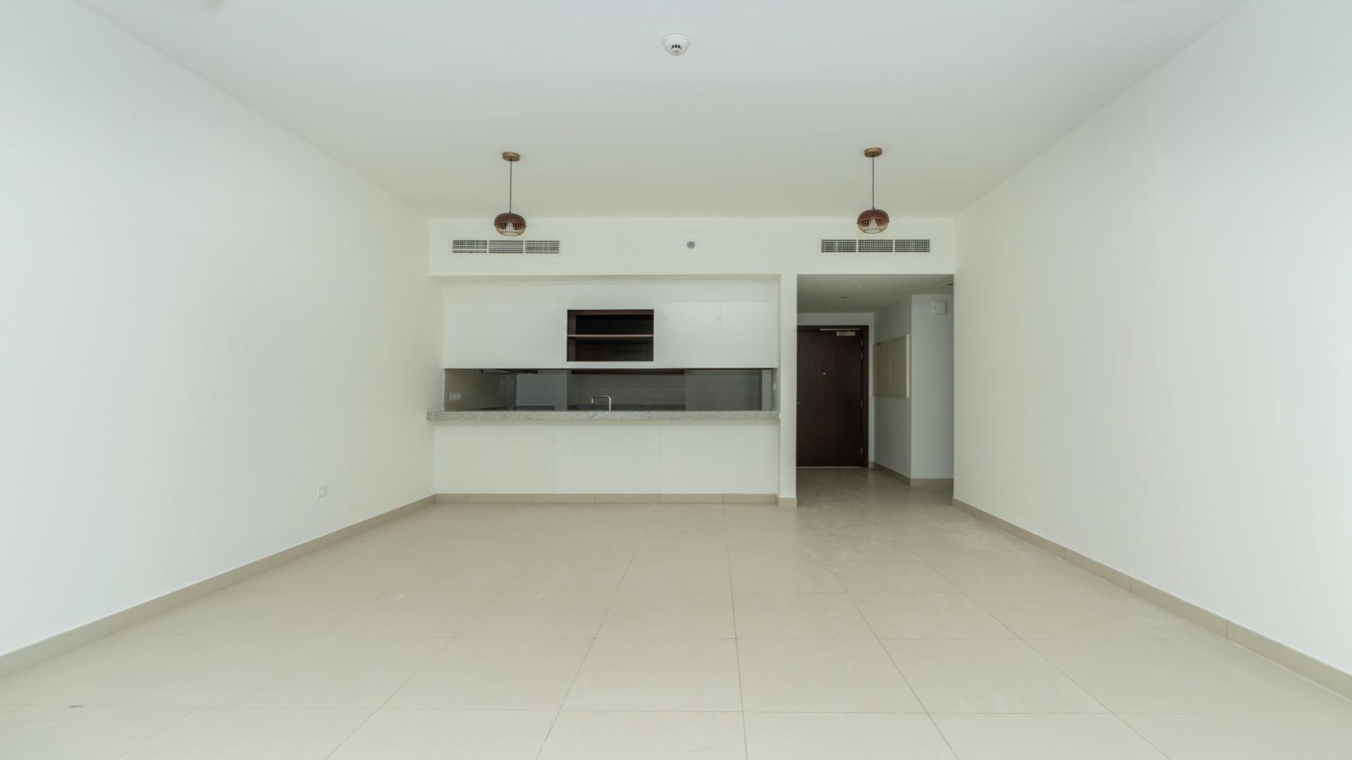 Balcony view of pool and park at Dubai Hills Estate apartment for rent