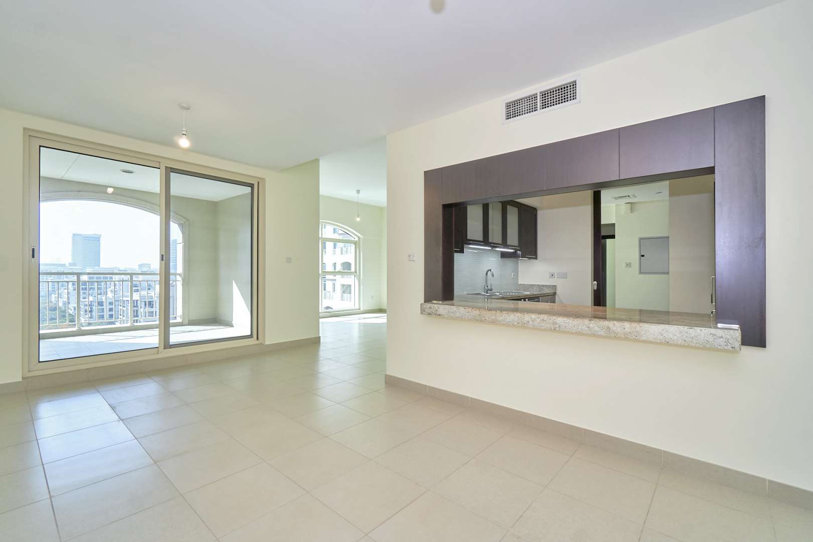 Modern apartment view with lush greenery and water features in Mosela, The Greens