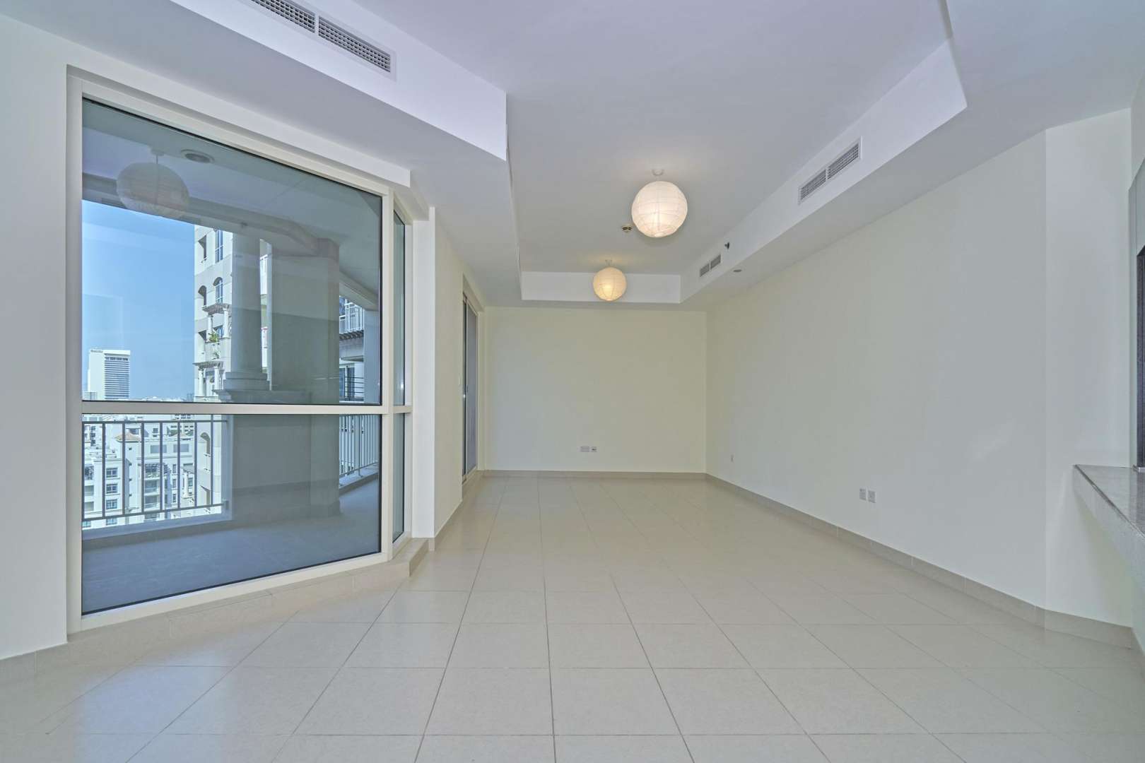 Aerial view of Mosela apartment buildings with lake in The Views, Dubai