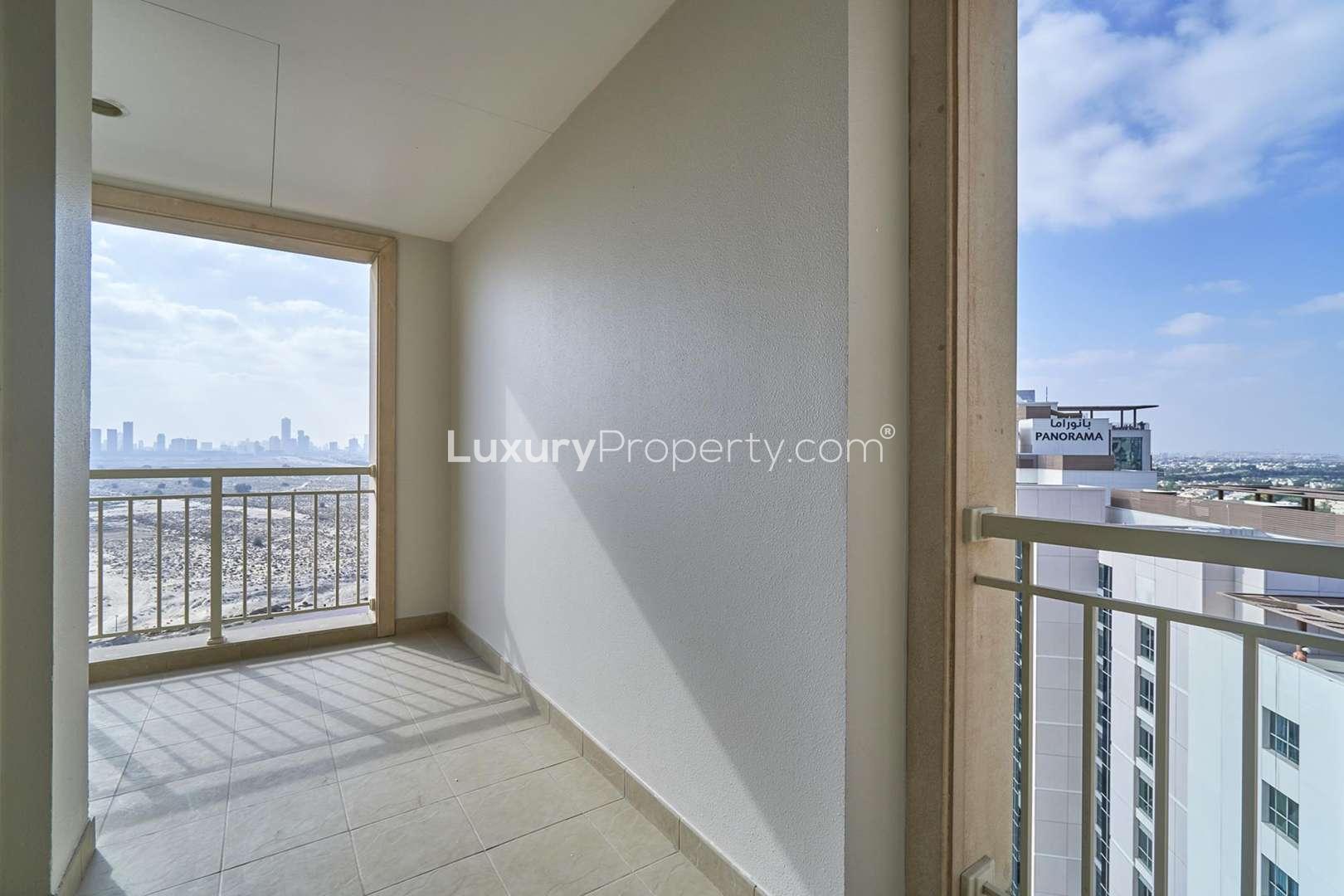 Aerial view of Mosela Tower and surrounding greenery, The Greens, Dubai