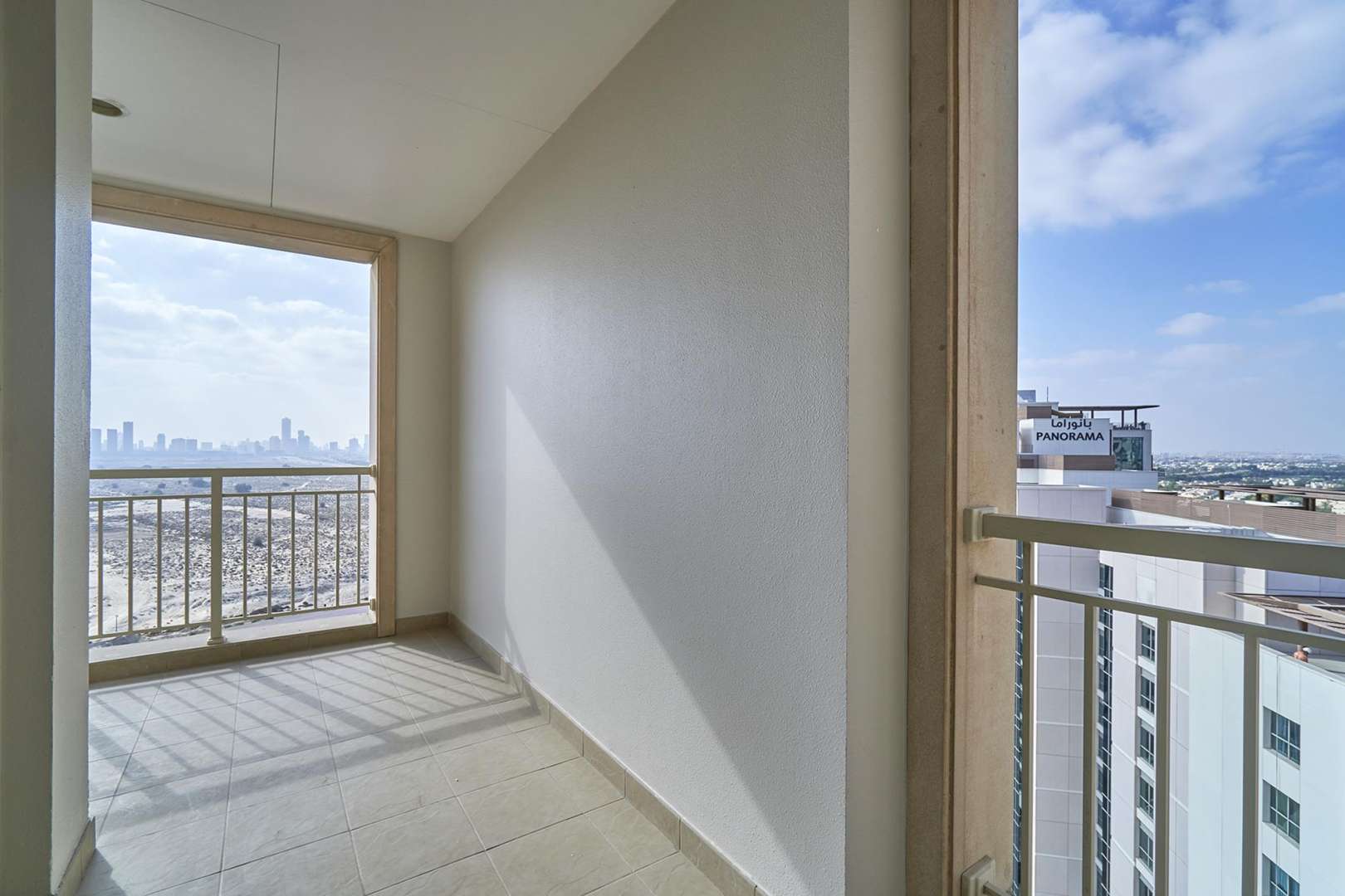 Aerial view of Mosela Tower and surrounding greenery, The Greens, Dubai