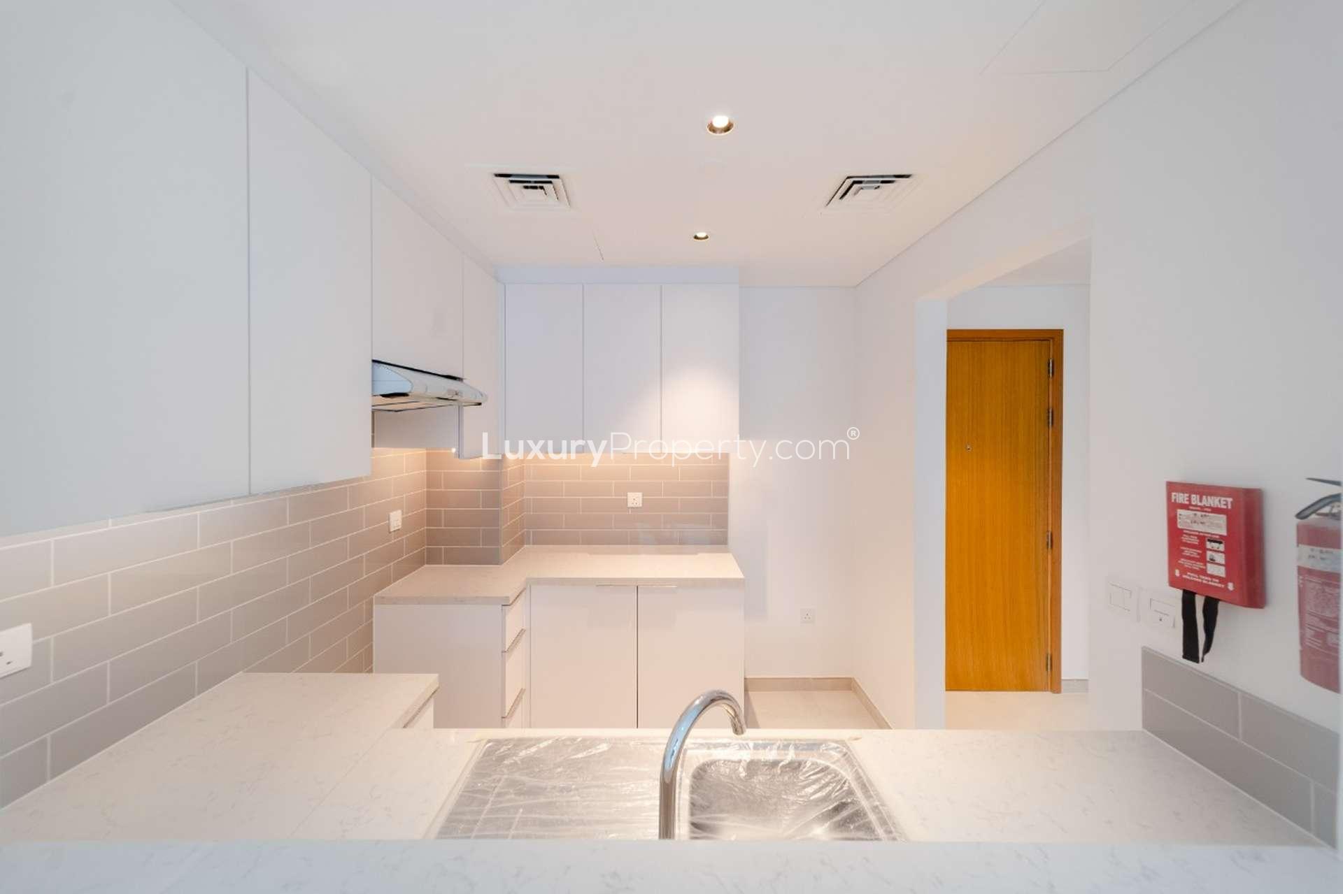 Contemporary open-plan living area in 2-bedroom Mudon Views apartment for rent