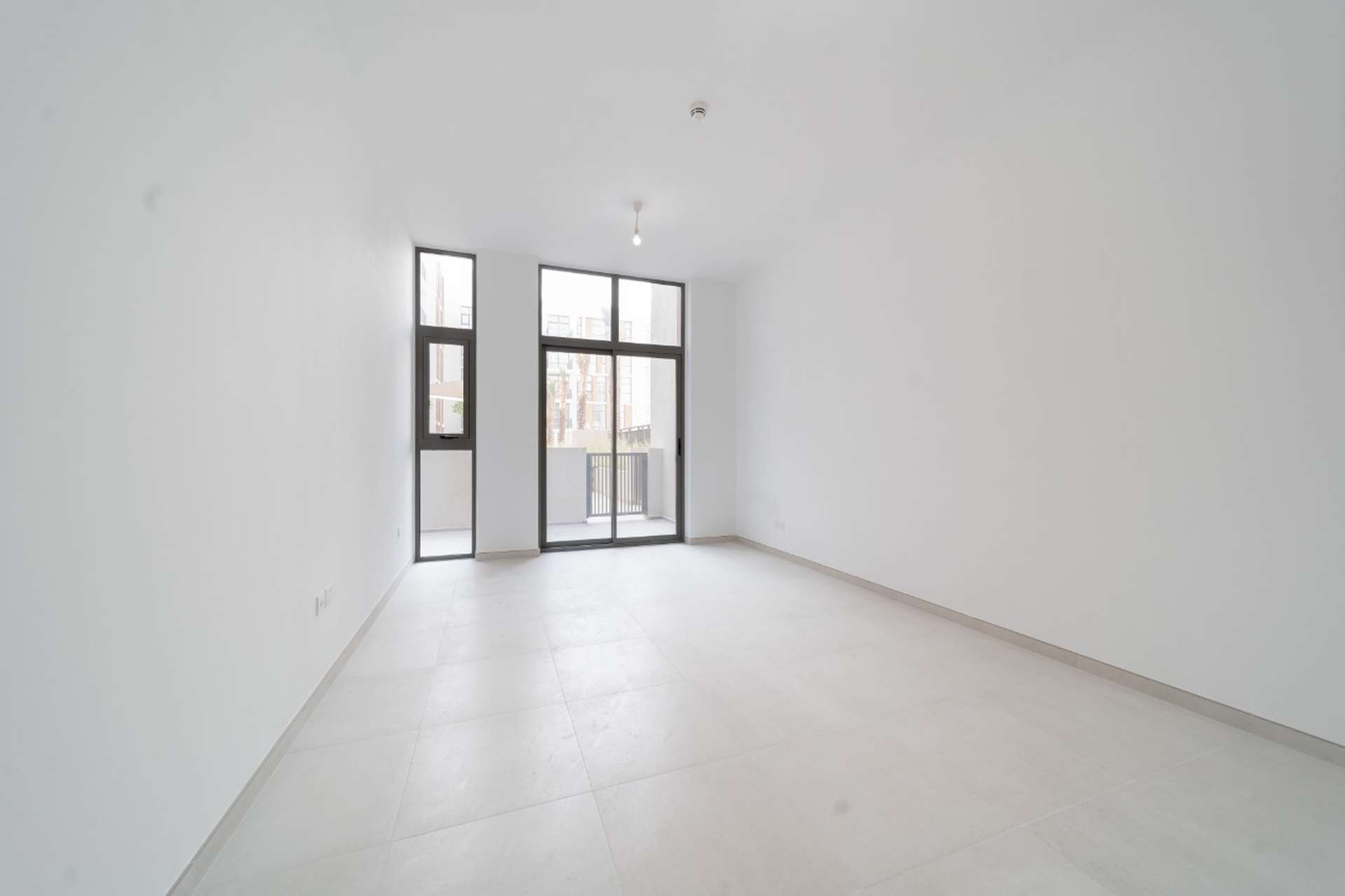 Contemporary apartment building exterior in Mudon Views, Dubai, featuring modern architectural design