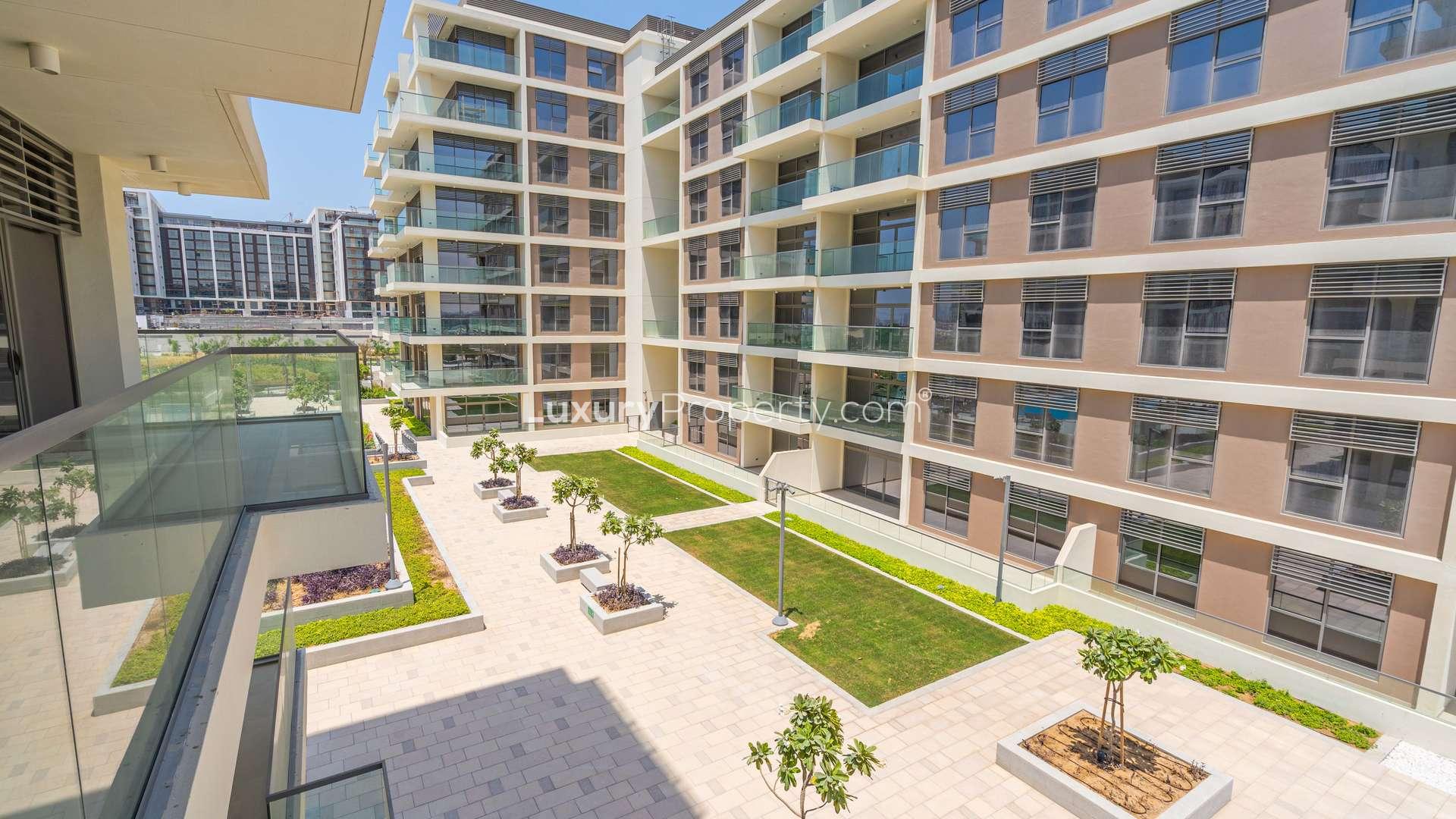 "View of modern apartment complex courtyard in Mulberry, Dubai Hills Estate, Park Heights.",Luxurious bathroom with dual sinks in 2-bedroom apartment, Mulberry, Dubai Hills Estate