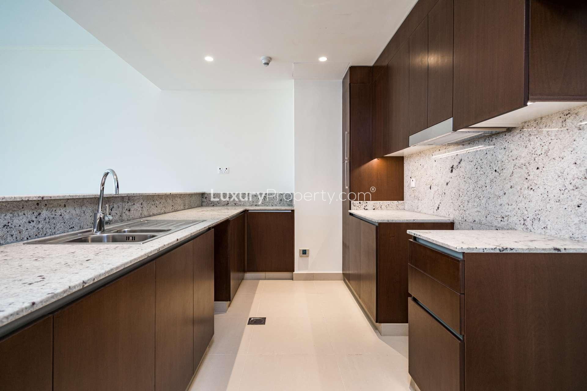 Empty room with large window, park views, in Mulberry Park Heights apartment, Dubai Hills Estate